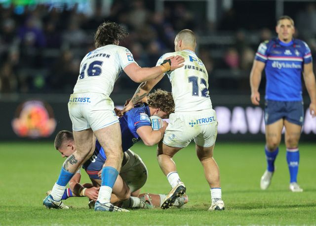 Harvey Smith of Wakefield Trinity is tackled by Mathieu Jussaume of Toulouse Olympique during the Betfred Super League Round 1 match Wakefield Trinity vs Toulouse Olympique at DIY Kitchens Stadium, Wakefield, United Kingdom on 14 February 2026

(Photo by Richard Bierton/News Images)