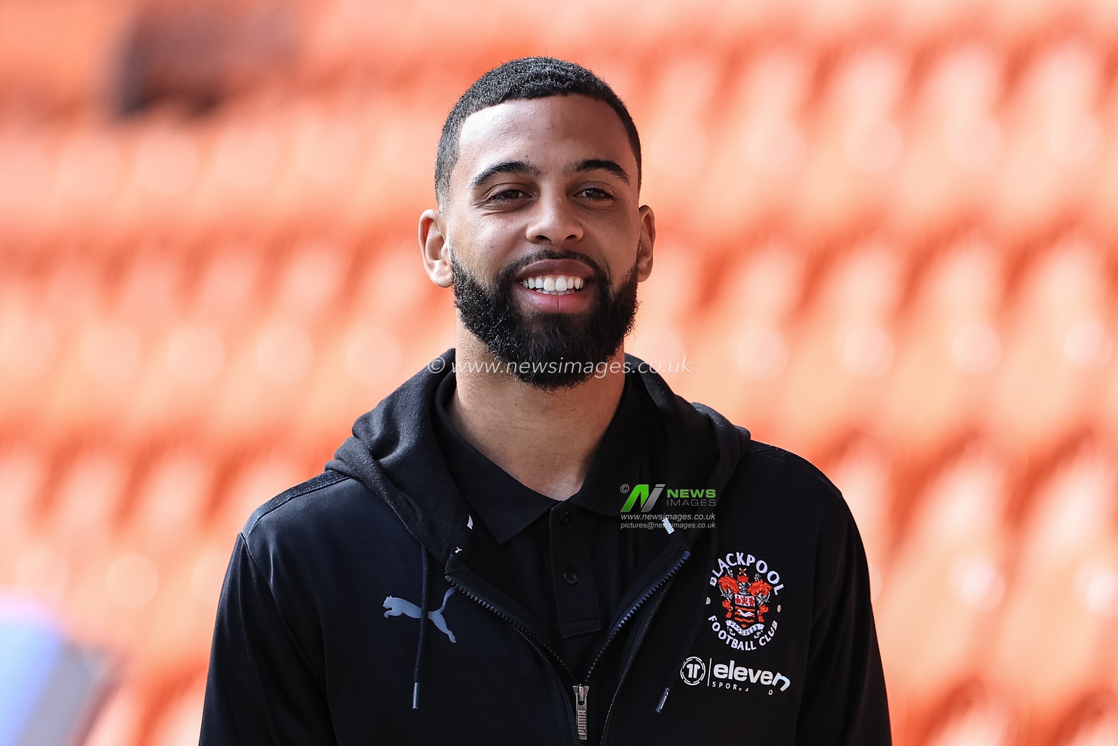 CJ Hamilton #22 of Blackpool arrives at Bloomfield Road