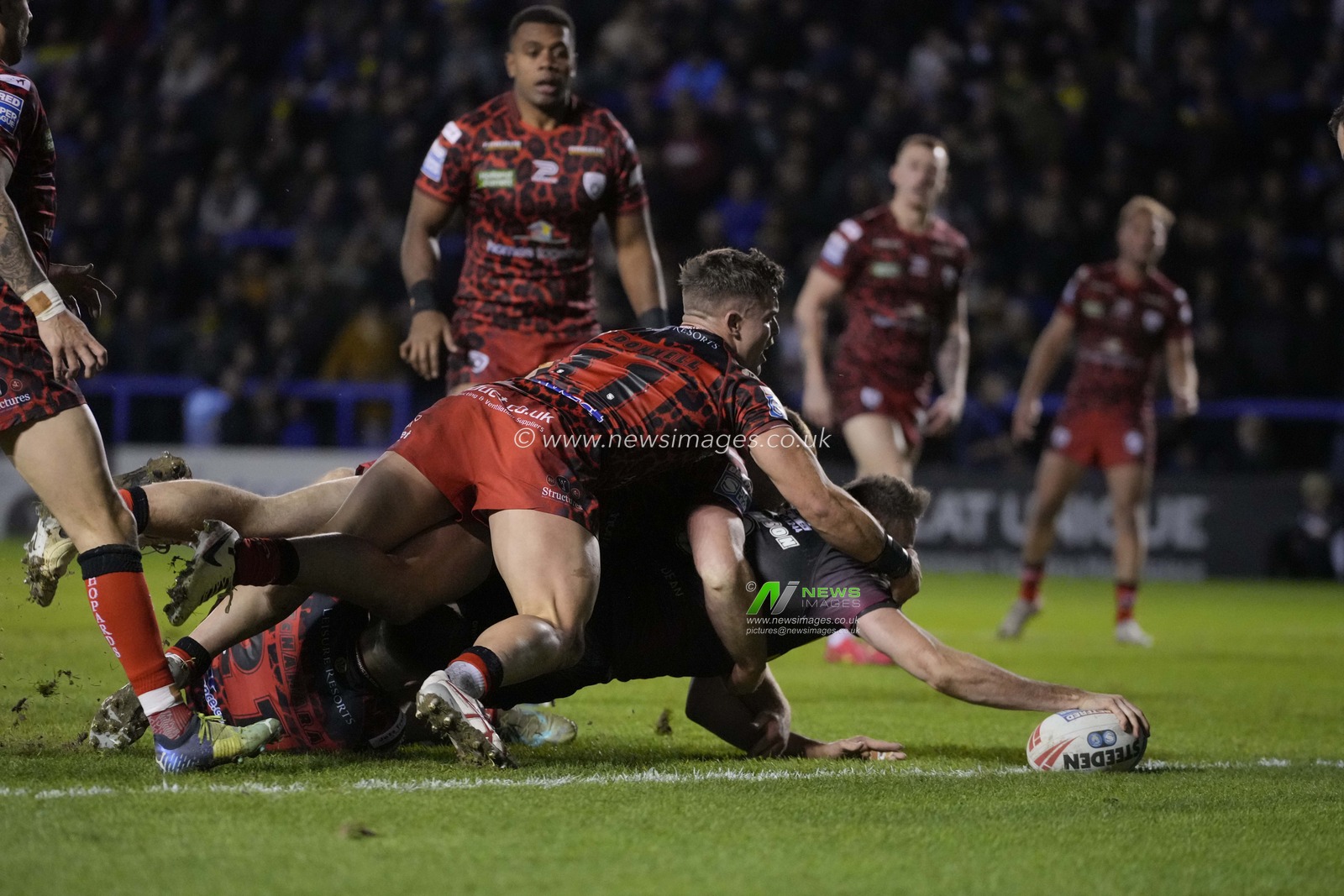 James Harrison of Warrington Wolves dives over to score a try during the Rugby League Joe Philbin Testimonial match Warrington Wolves vs Leigh Leopards at Halliwell Jones Stadium, Warrington, United Kingdom, 3rd February 2024

(Photo by Steve Flynn/News Images)