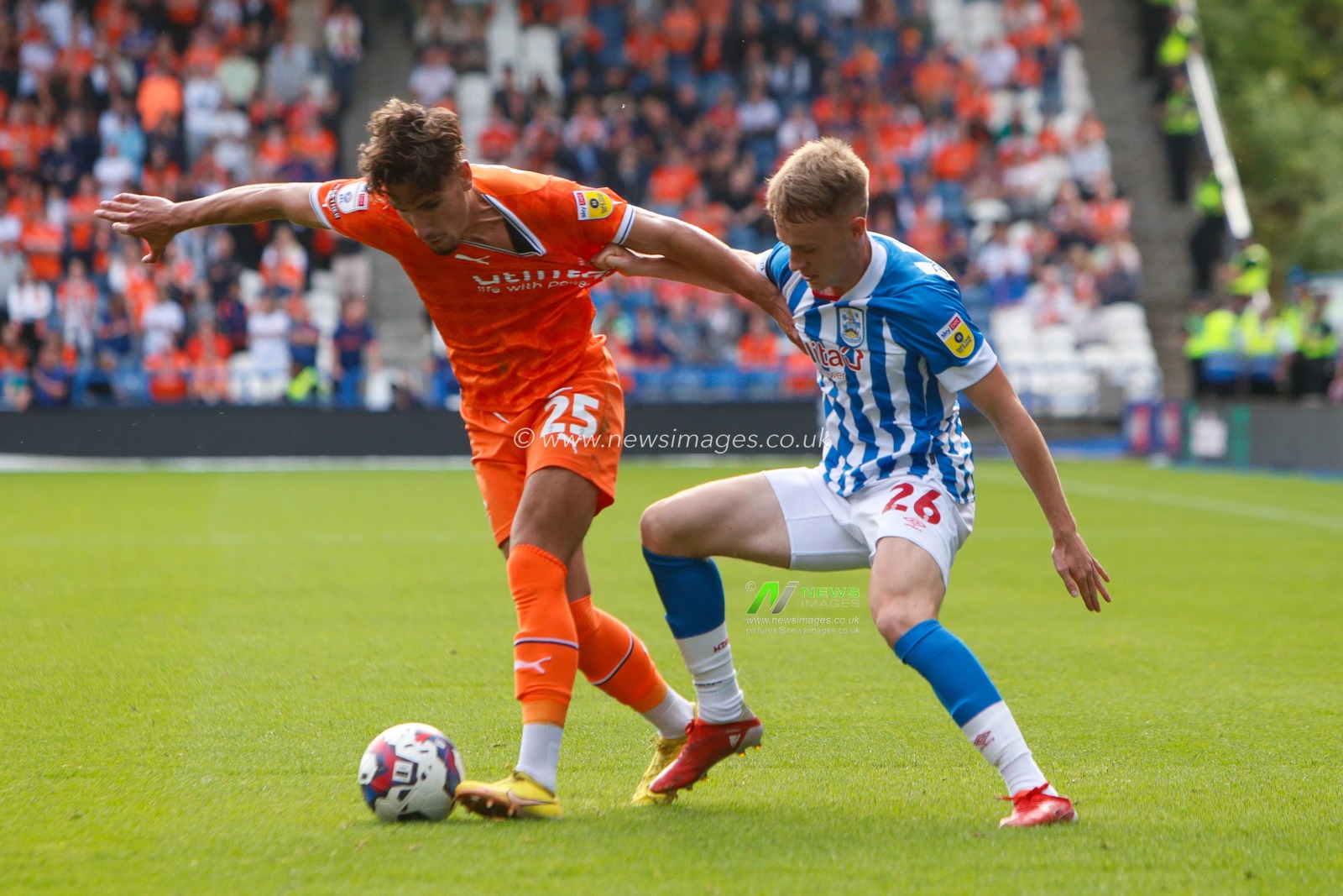 Pat Jones #26 of Huddersfield Town and Theo Corbeanu #25 of Blackpool during the Sky Bet Championship match Huddersfield Town vs Blackpool at John Smith's Stadium, Huddersfield, United Kingdom, 4th September 2022

(Photo by Ben Early/News Images)