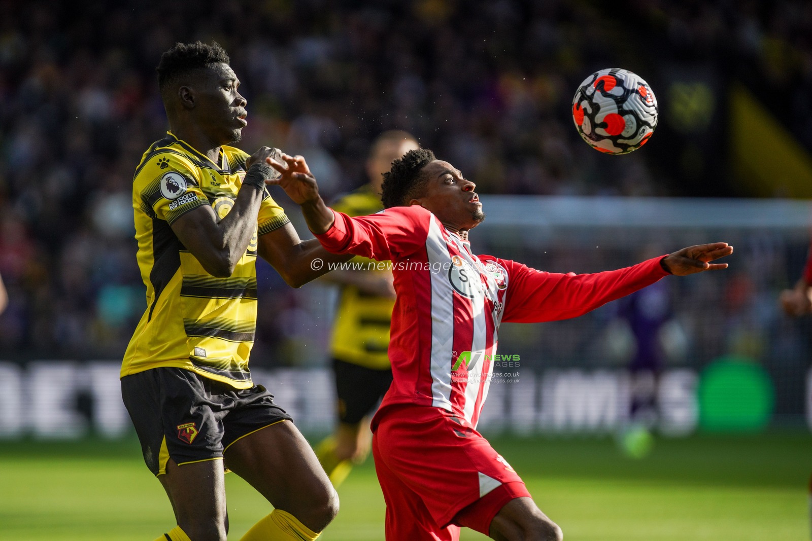 Ismaila Sarr #23 of Watford battle for the ball with Kyle Walker-Peters #2 of Southampton