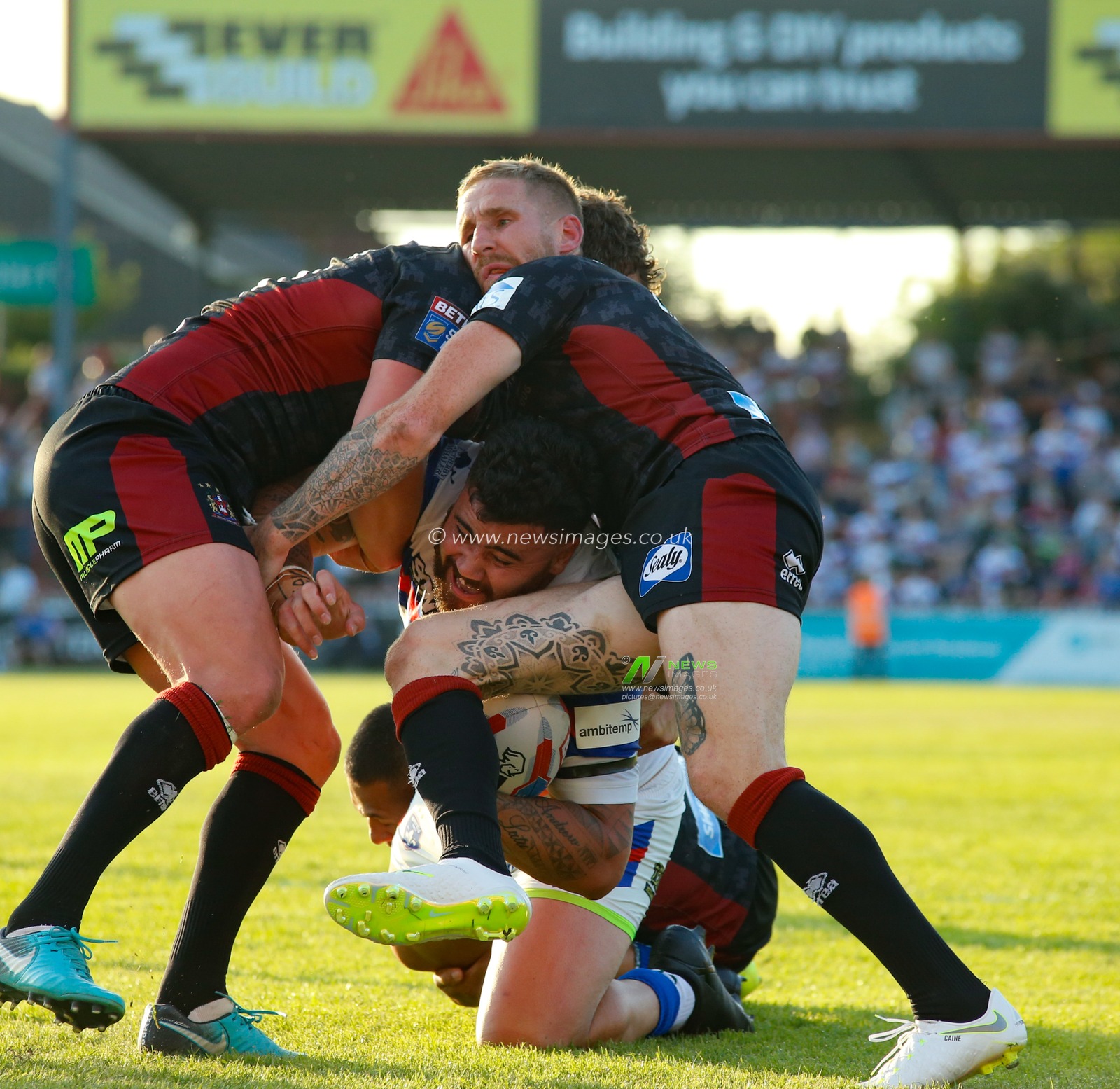 Thursday 7th June 2018 , Mobile Rocket Stadium, Wakefield, England; Betfred Super League, Wakefield Trinity v Wigan Warriors; David Fifita of Wakefield Trinity tackled by Sean Oâ€™Loughlin  and Sam Tomkins.