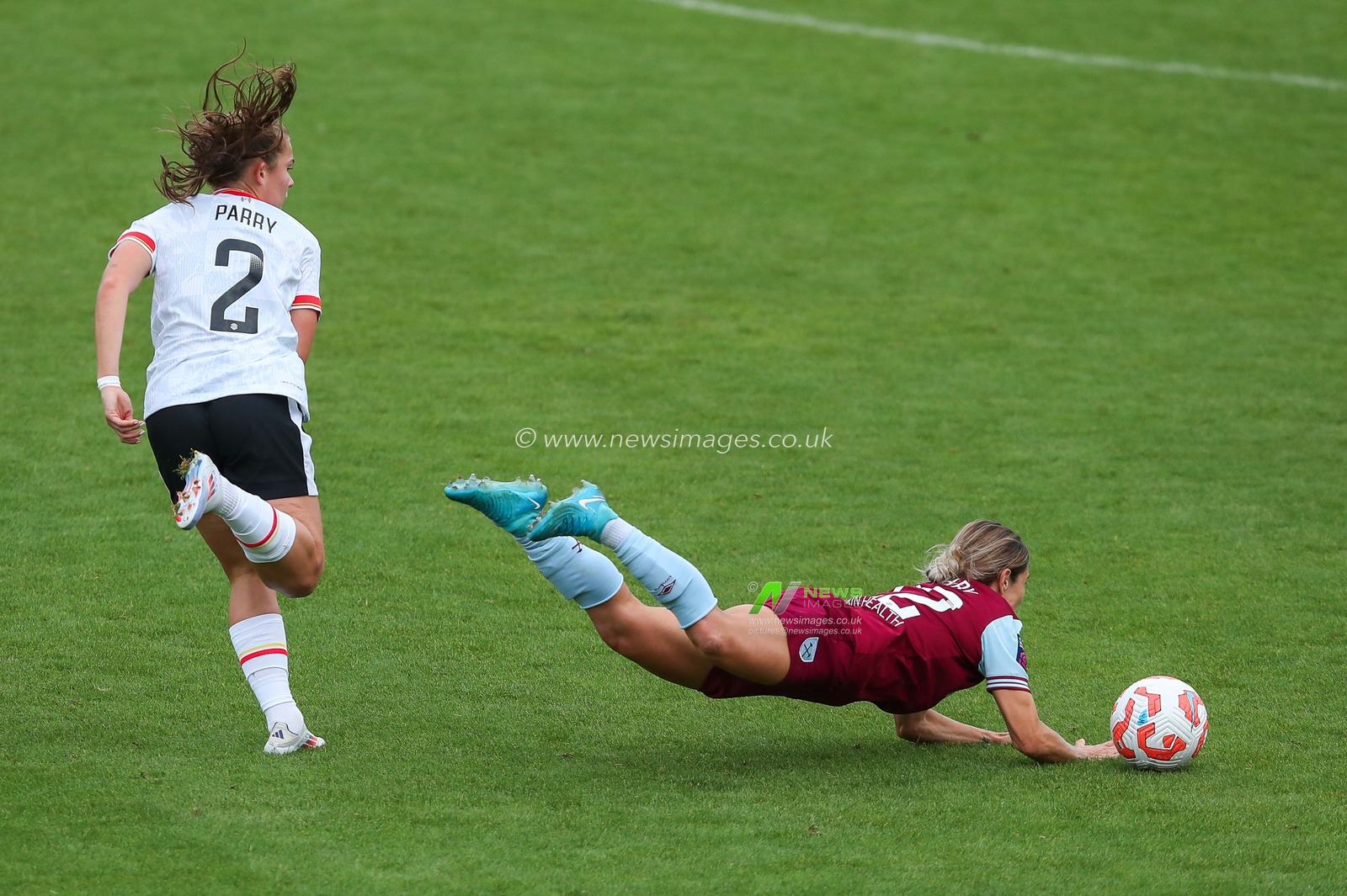 Katrina Gorry of West Ham United is challenged by Lucy Parry of Liverpool during the The FA Women's Super League match West Ham United Women vs Liverpool Women at The Chigwell Construction Stadium, London, United Kingdom, 29th September 2024

(Photo by Izzy Poles/News Images)