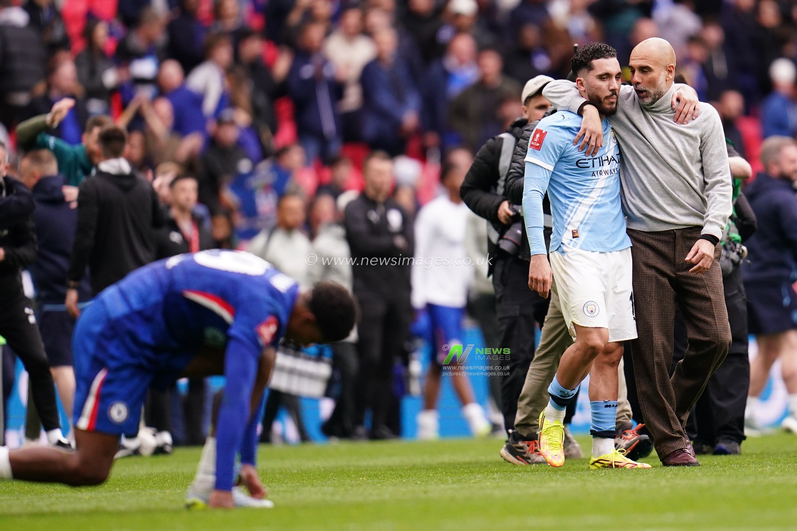Josep Guardiola manager of Manchester City and Rayan Cherki of Manchester City at full time during the Emirates FA Cup Final match Chelsea vs Manchester City at Wembley Stadium, London, United Kingdom on 16 May 2026

(Photo by Harvey Murphy/News Images)