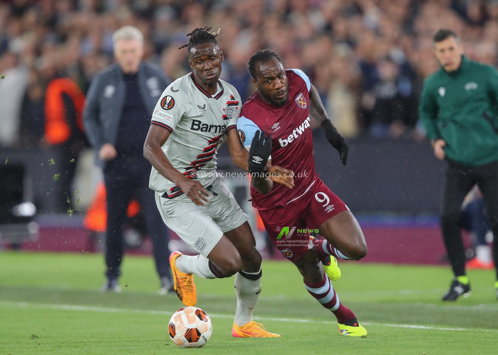 Odilon Kossounou of Bayer Leverkusen tackles Michail Antonio of West Ham United, during the UEFA Europa League Quarter-Final match West Ham United vs Bayer 04 Leverkusen at London Stadium, London, United Kingdom, 18th April 2024

(Photo by Gareth Evans/News Images)