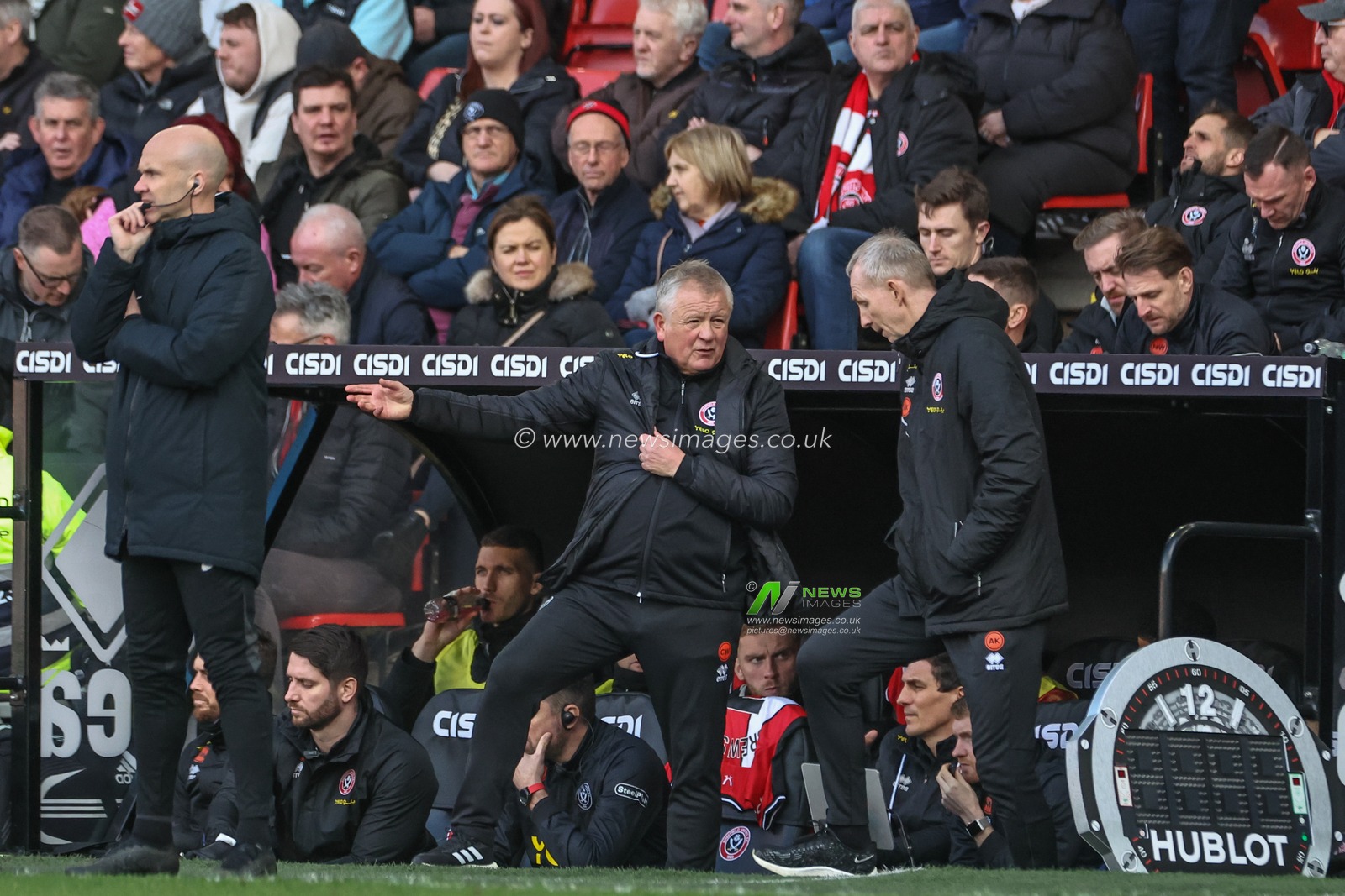 Chris Wilder manager of Sheffield United speaks to Alan Knill during the Premier League match Sheffield United vs Brighton and Hove Albion at Bramall Lane, Sheffield, United Kingdom, 18th February 2024

(Photo by Mark Cosgrove/News Images)