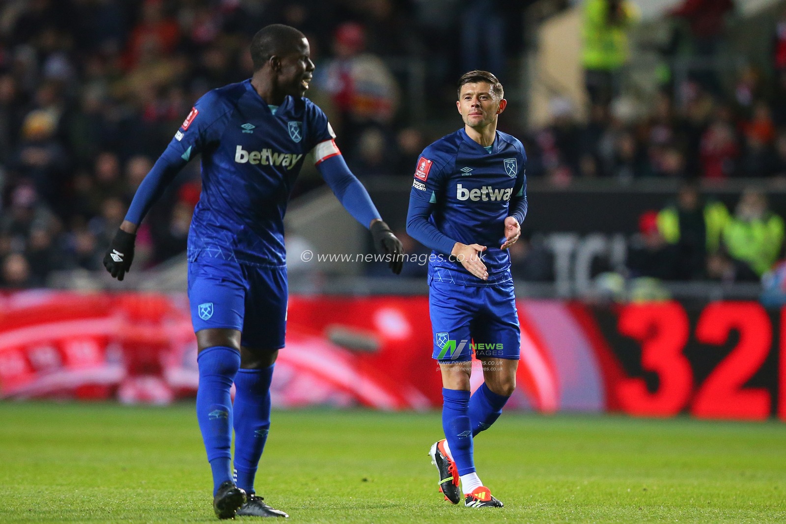 Aaron Cresswell of West Ham United talks to Kurt Zouma of West Ham United during the Emirates FA Cup Third Round Replay match Bristol City vs West Ham United at Ashton Gate, Bristol, United Kingdom, 16th January 2024

(Photo by Gareth Evans/News Images)