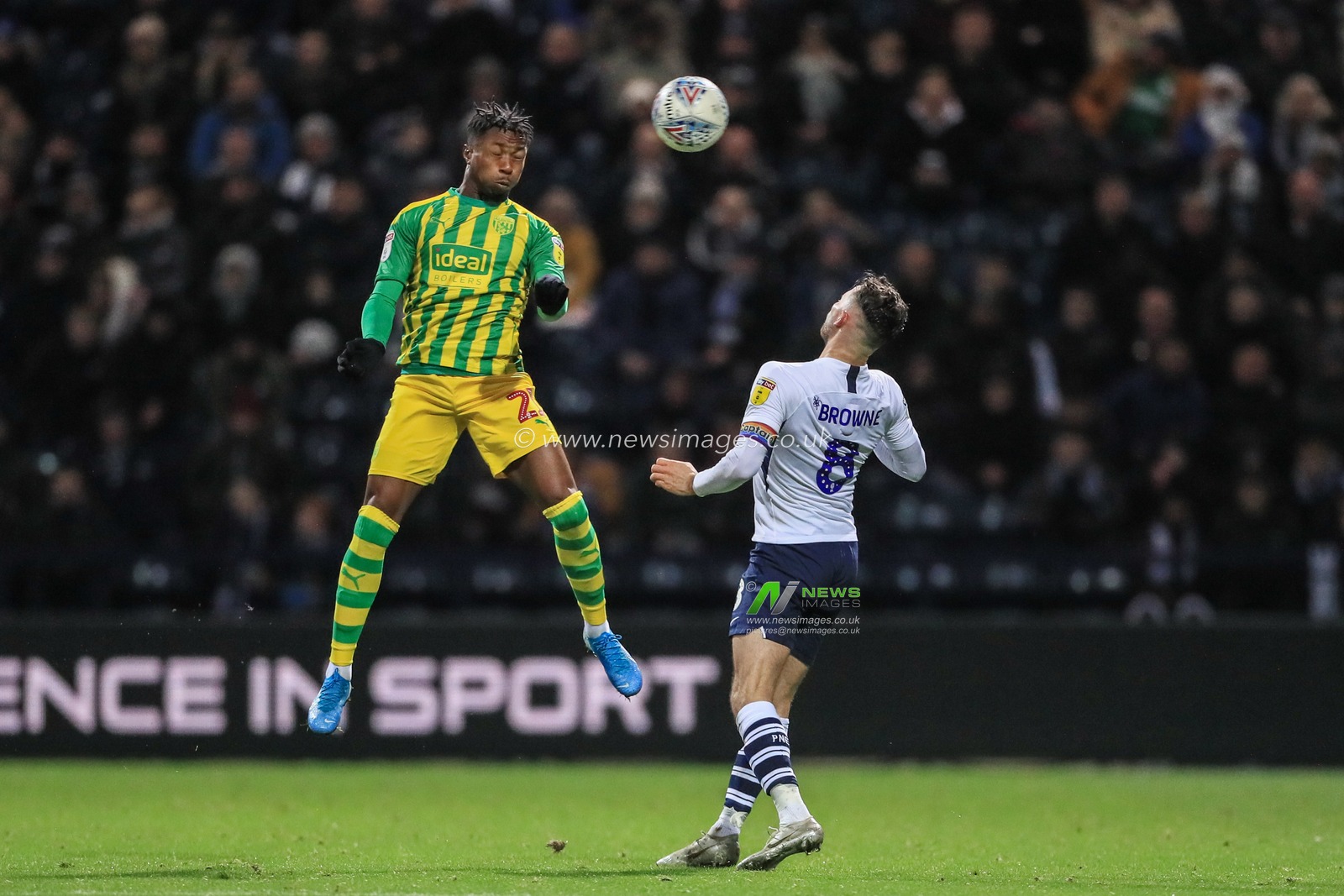 2nd December 2019, Deepdale, Preston, England; Sky Bet Championship, Preston North End v West Bromwich Albion : Kyle Edwards (21) of West Bromwich Albion heads clear as Alan Browne (8) of Preston North End pressures 

Credit: Mark Cosgrove/News Images