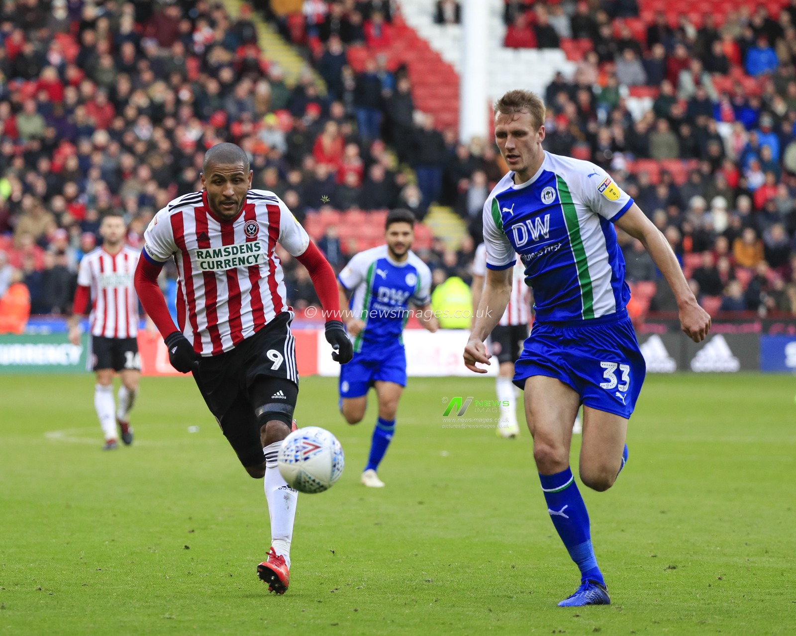 27th October 2018, Bramall Lane, Sheffield, England; Sky Bet Championship, Sheffield United v Wigan ;Leon Clarke (09) of Sheffield United and Dan Burn (33) of Wigan Athletic challenge for the ball

Credit: Conor Molloy/News Images

English Football League images are subject to DataCo Licence