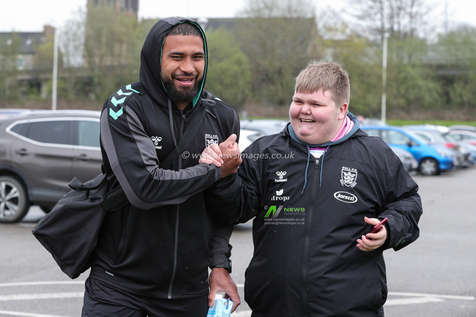 Chris Satae #10 of Hull FC meets with a fan as he arrives at The MKM Stadium ahead of the Betfred Super League Round 10 match Hull FC vs Huddersfield Giants at MKM Stadium, Hull, United Kingdom, 23rd April 2023

(Photo by James Heaton/News Images)
