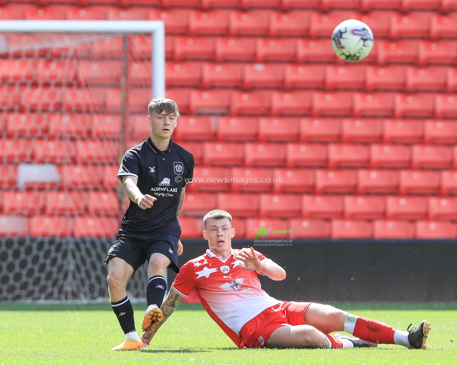 Kacper Lopata #4 of Barnsley makes a tackle during the Pre-season friendly match Barnsley vs Crewe Alexandra at Oakwell, Barnsley, United Kingdom, 29th July 2023

(Photo by Alfie Cosgrove/News Images)