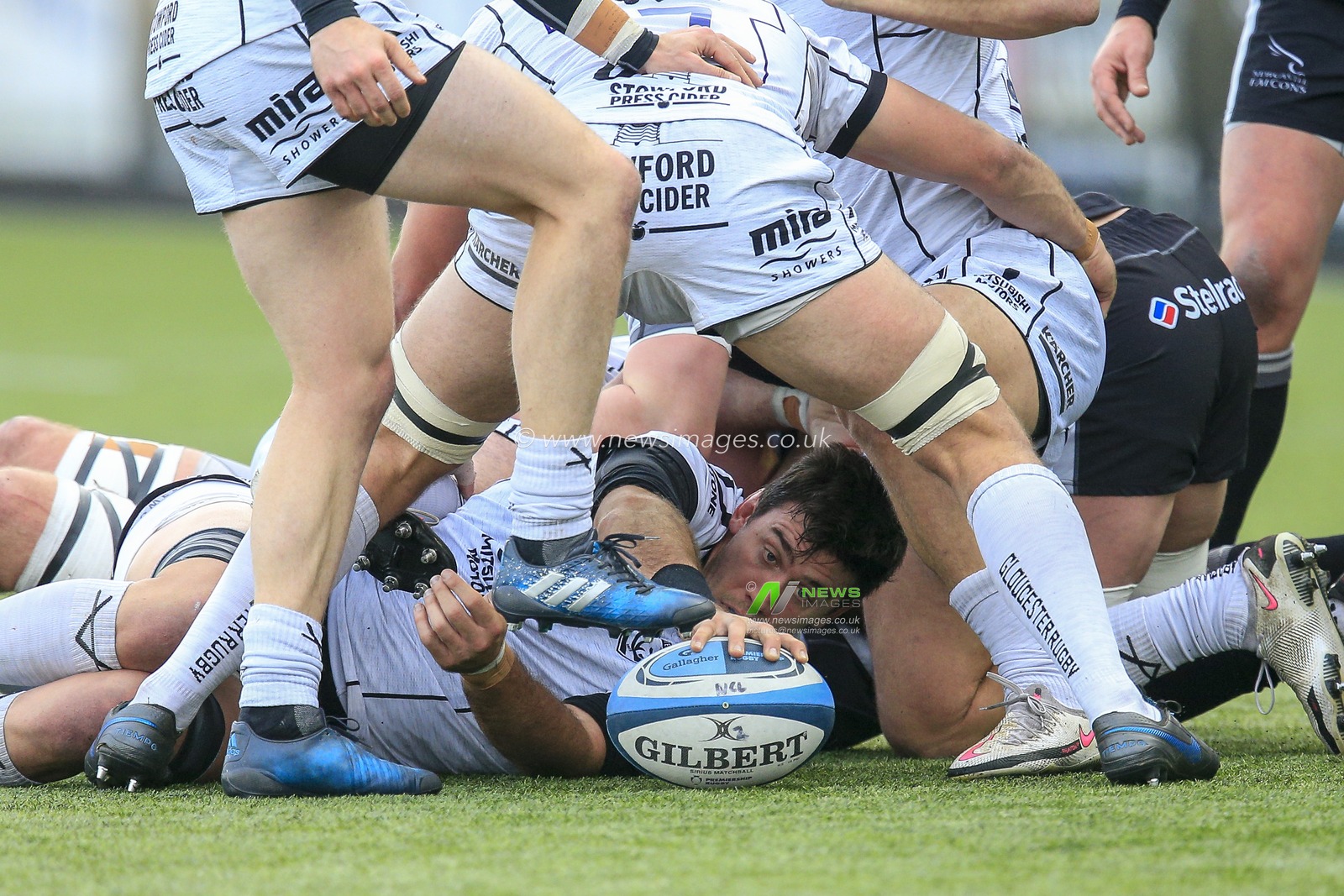 Matias Alemanno of Gloucester Rugby places the ball down for Joe Simpson of Gloucester Rugby