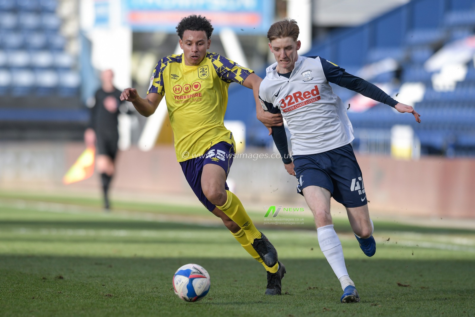 Rarmani Edmonds-Green #35 of Huddersfield Town challenges Anthony Gordon #42 of Preston North End for the ball