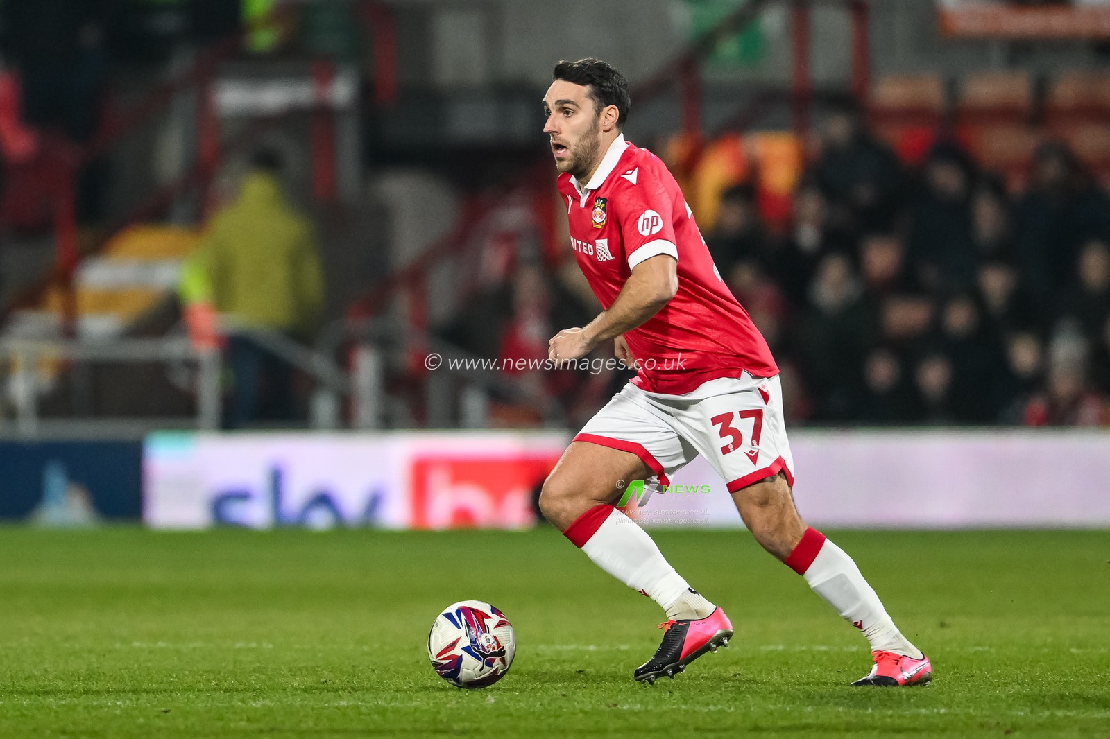 Matthew James of Wrexham makes a break with the ball during the Sky Bet League 1 match Wrexham vs Leyton Orient at SToK Cae Ras, Wrexham, United Kingdom, 18th February 2025

(Photo by Craig Thomas/News Images)