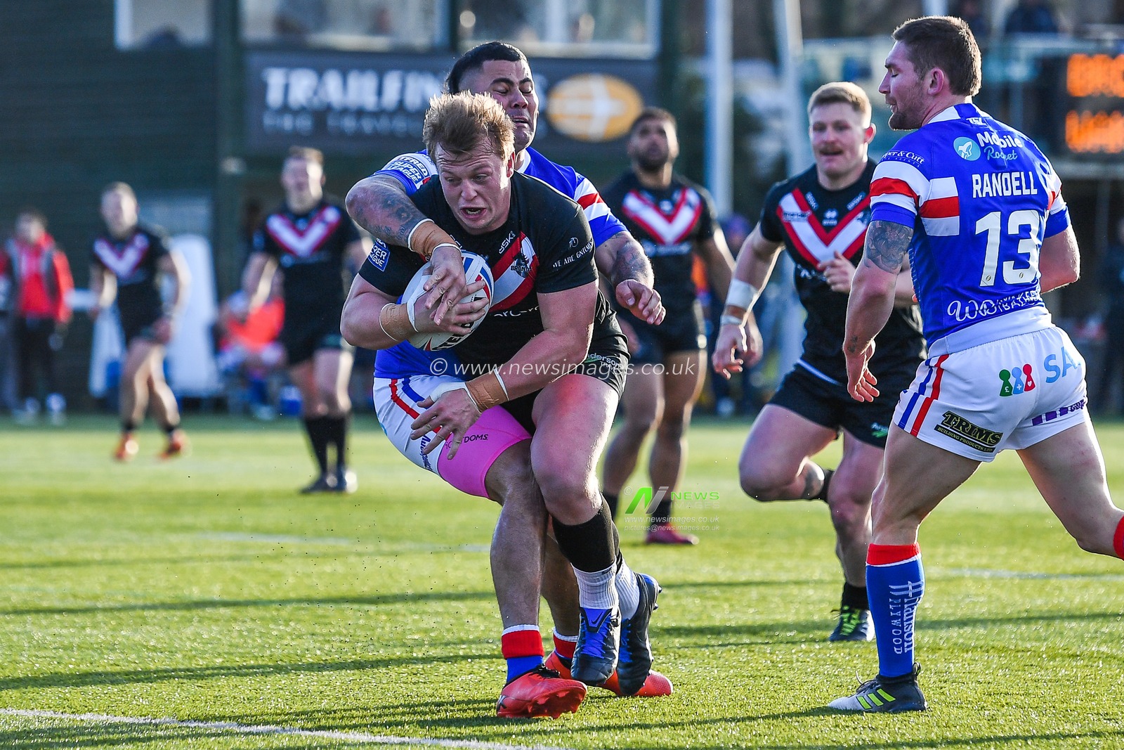 3rd February 2019 , Trailfinders Sports Ground, London, England; Betfred Super League, Round 1, London Broncos vs Wakefield Trinity ; Eddie Battye (8) of London Broncos is tackled by David Fifita (8) of Wakefield Trinity


Credit: Craig Thomas/News Images