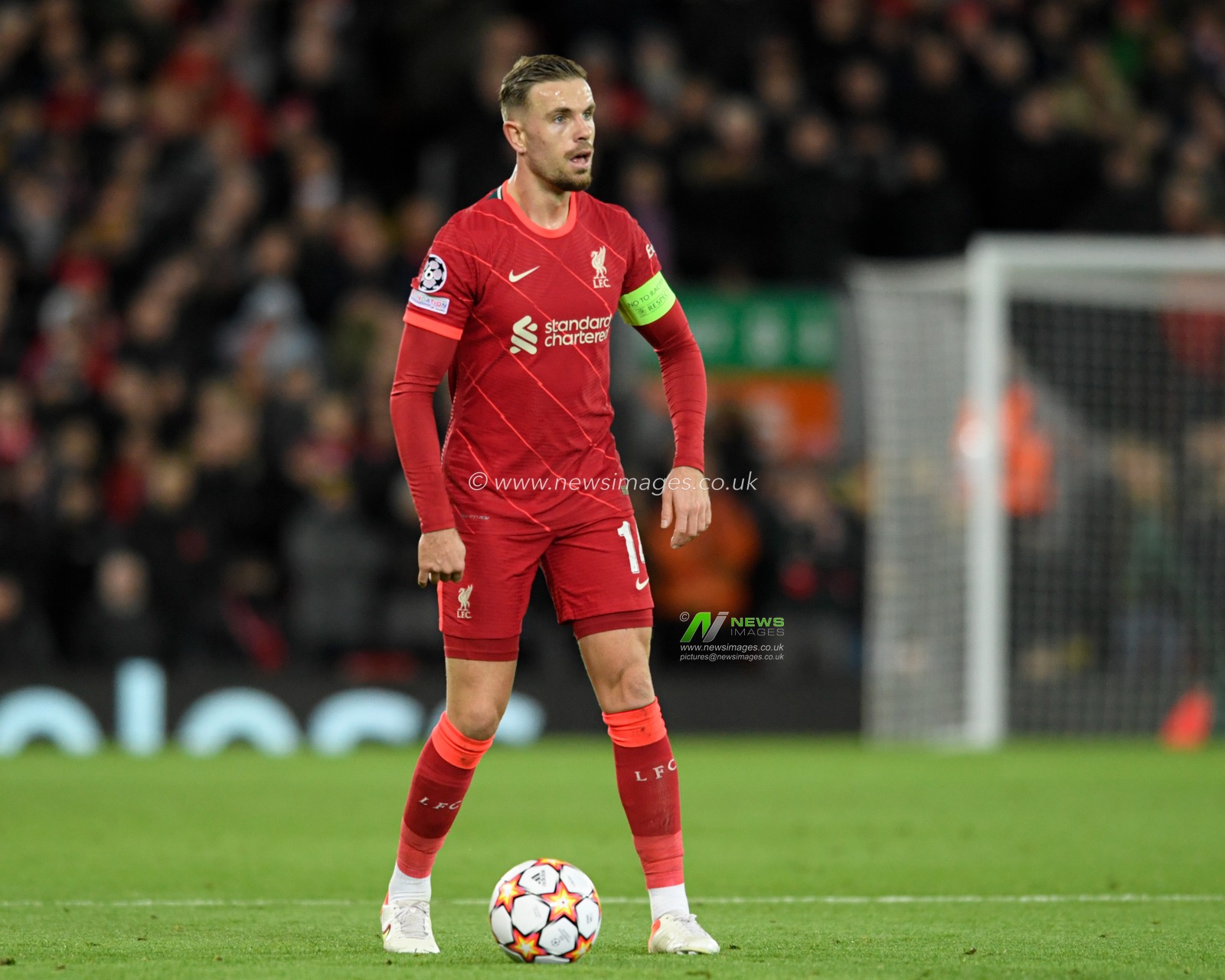 Jordan Henderson #14 of Liverpool looks for a passing option
