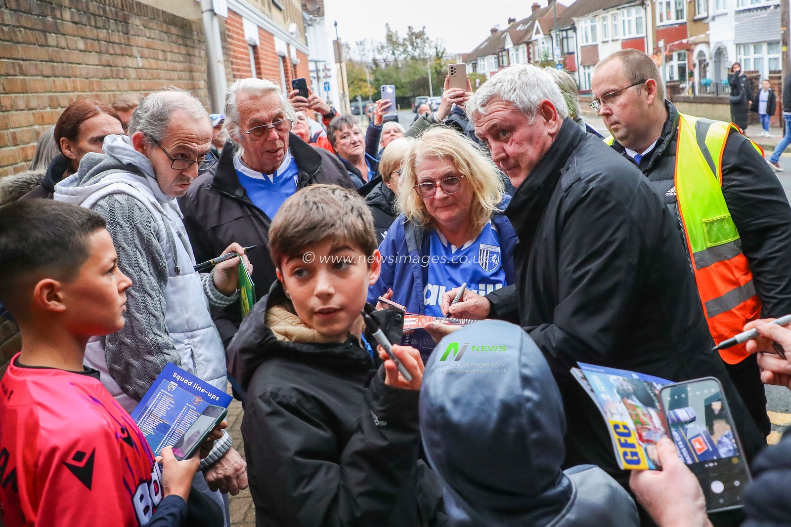 Steve Bruce of Blackpool signs his autograph with fans prior to the Emirates FA Cup First Round match Gillingham vs Blackpool at MEMS Priestfield Stadium, Gillingham, United Kingdom, 2nd November 2024

(Photo by Izzy Poles/News Images)
