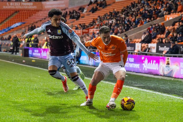 Elliot Embleton of Blackpool  holds off Kyrie Pierre of Aston Villa during the Vertu Trophy match Blackpool vs Aston Villa U21 at Bloomfield Road, Blackpool, United Kingdom, 17th December 2024

(Photo by Craig Thomas/News Images)