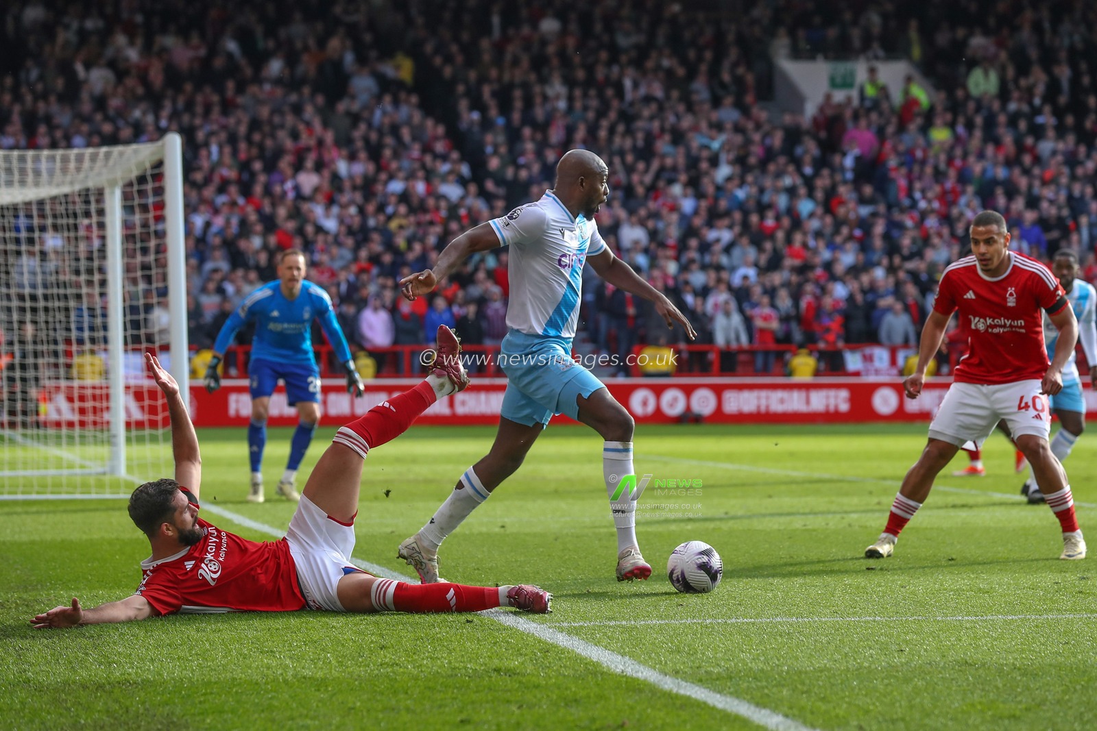 Jean-Philippe Mateta of Crystal Palace tackles Felipe of Nottingham Forest during the Premier League match Nottingham Forest vs Crystal Palace at City Ground, Nottingham, United Kingdom, 30th March 2024

(Photo by Gareth Evans/News Images)
