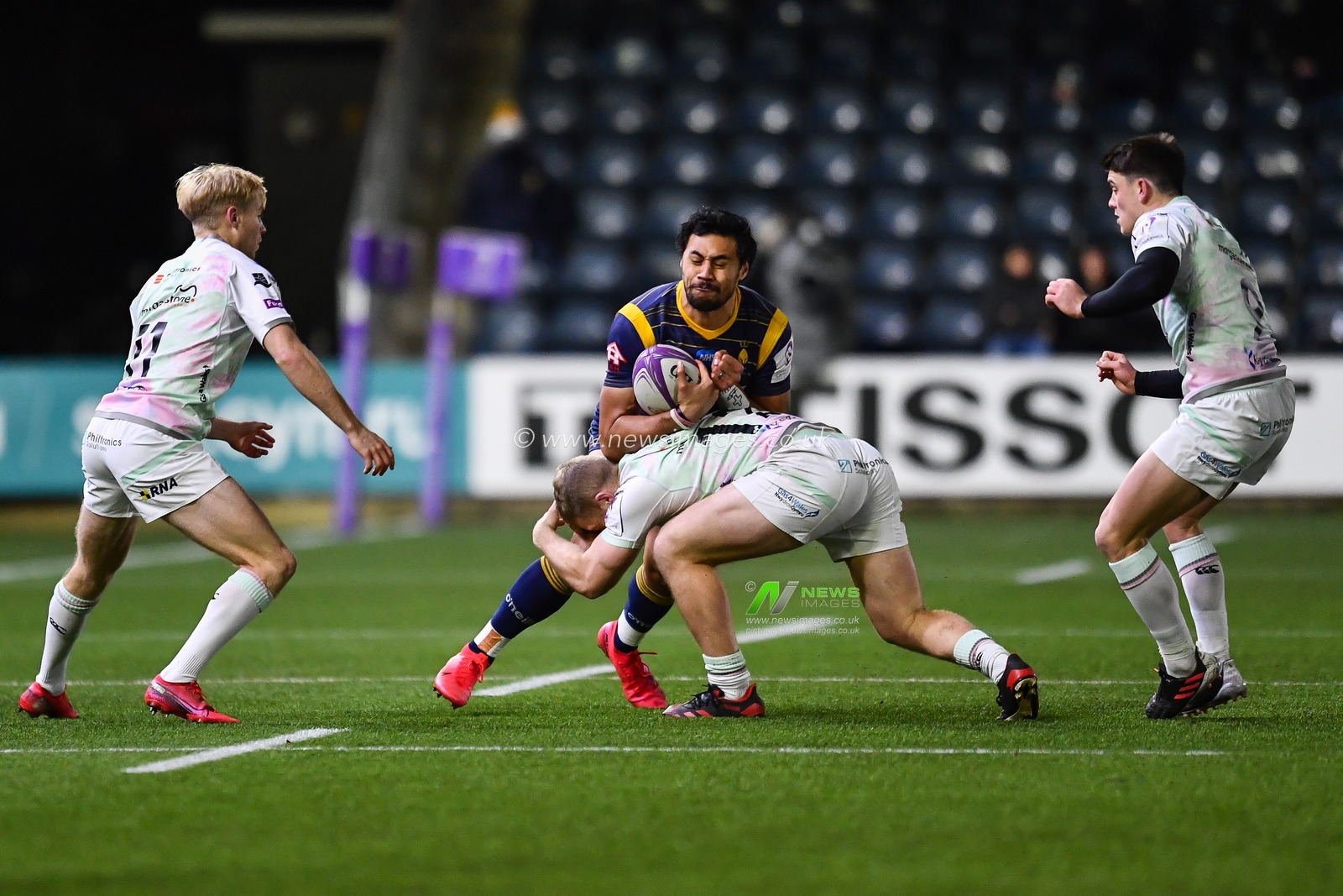 Melani Nanai of Worcester Warriors is tackled by Keiran Williams of Ospreys