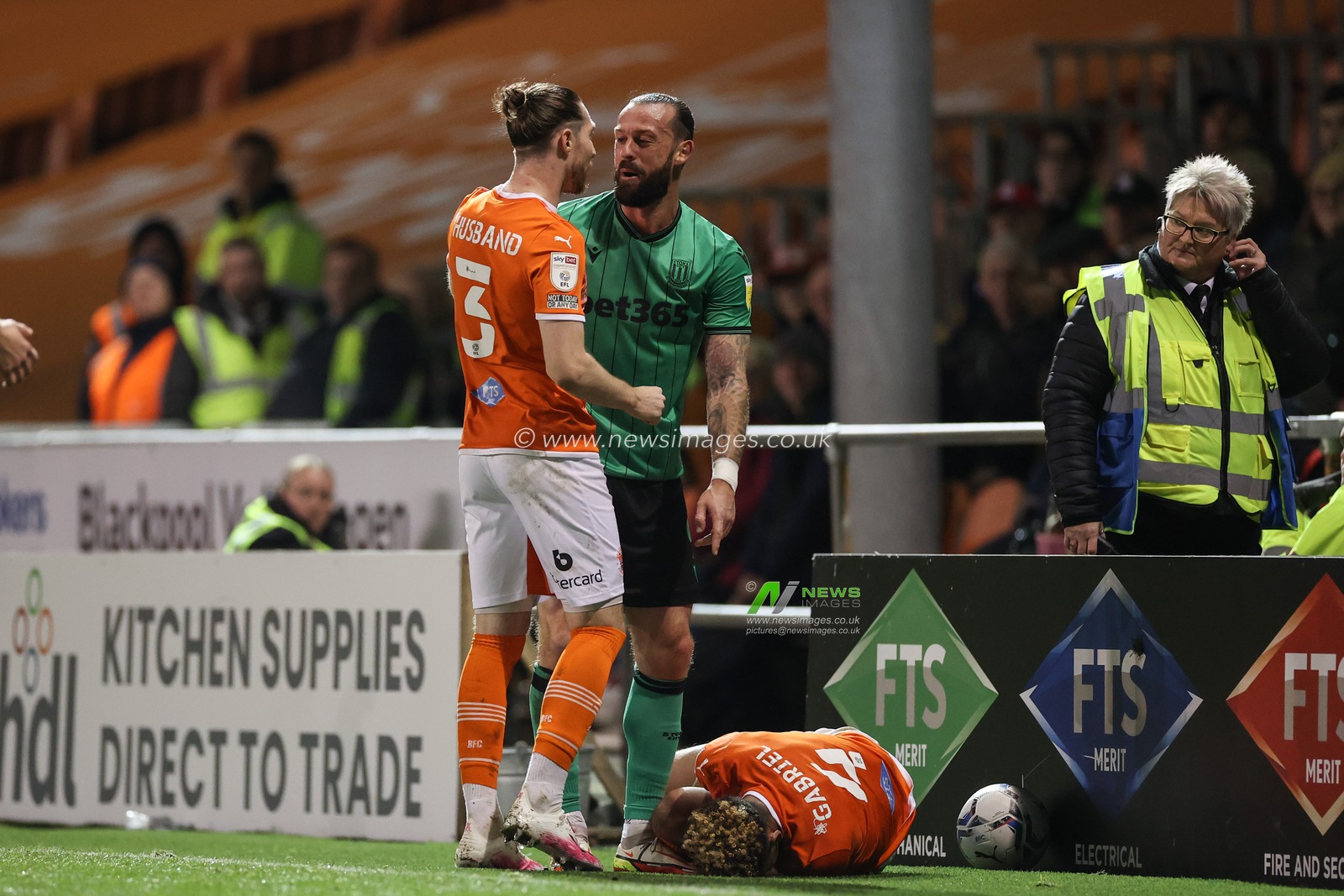James Husband #3 of Blackpool has words with Steven Fletcher #9 of Stoke City after he fouls Jordan Gabriel #4 of Blackpool