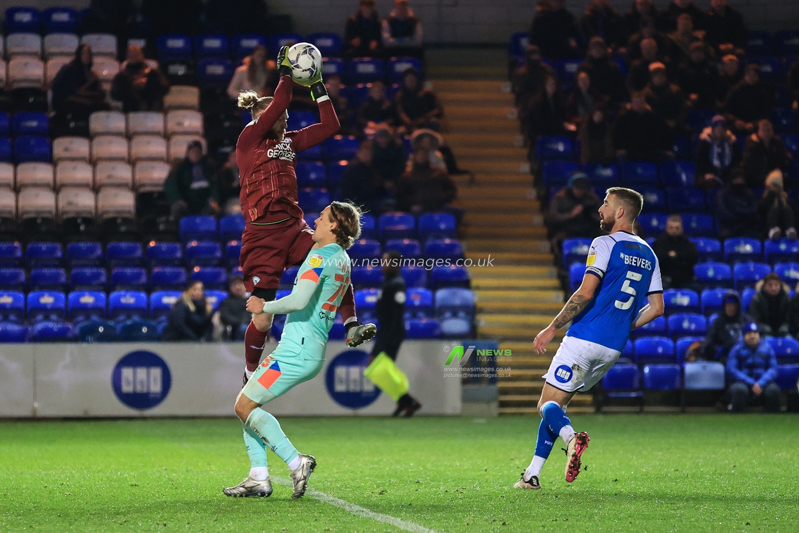 David Cornell #13 of Peterborough United collects the ball asDanny Ward #25 of Huddersfield Town challenges
