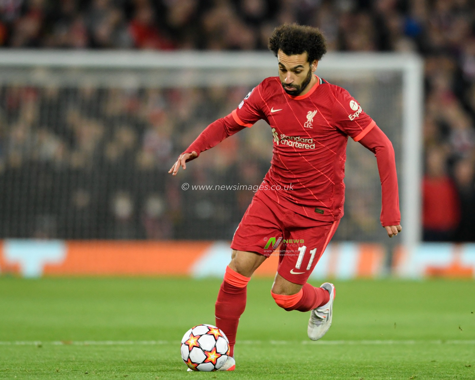 Mohamed Salah #11 of Liverpool runs forward with the ball