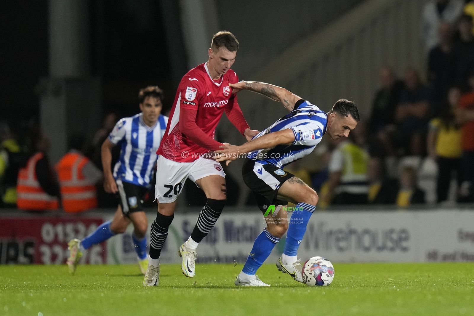 Liam Shaw of Morecambe competes for the ball with Lee Gregory of Sheffield Wednesday during the Sky Bet League 1 match Morecambe vs Sheffield Wednesday at Mazuma Stadium, Morecambe, United Kingdom, 13th September 2022

(Photo by Steve Flynn/News Images)