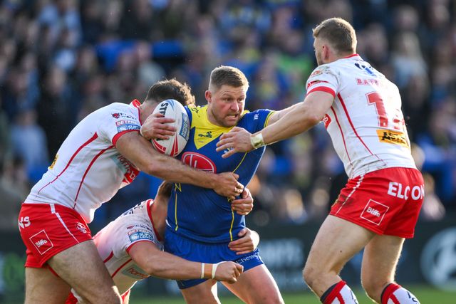 John Bateman of Warrington Wolves is tackled by Joe Batchelor of St. Helens and Alex Walmsley and Morgan Knowles of St. Helens  during the Betfred Super League play-off Eliminator 2 Warrington Wolves v St Helens at Halliwell Jones Stadium, Warrington, United Kingdom, 28th September 2024

(Photo by Craig Thomas/News Images)