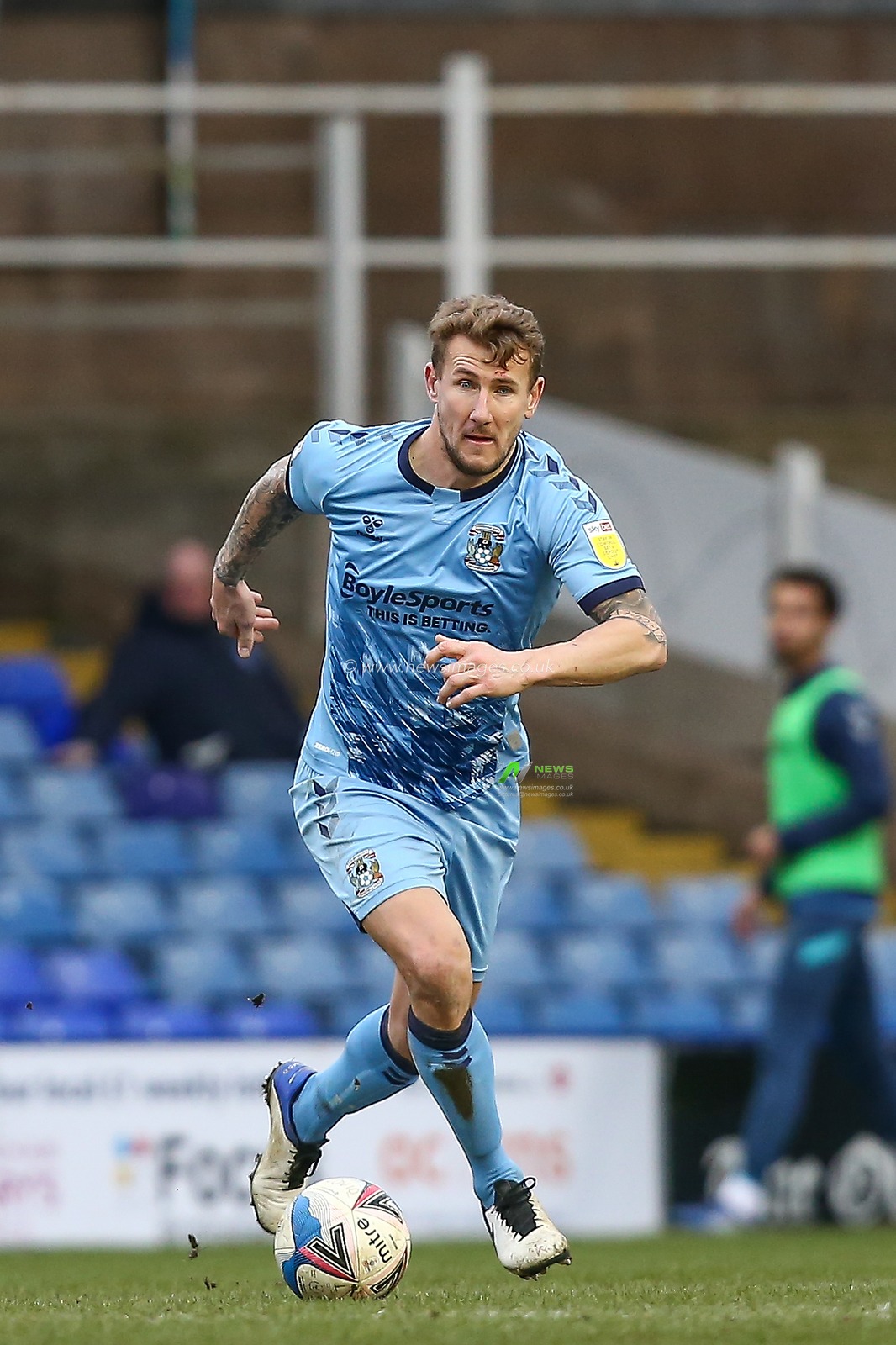 Kyle McFadzean #5 of Coventry City dribbles the ball