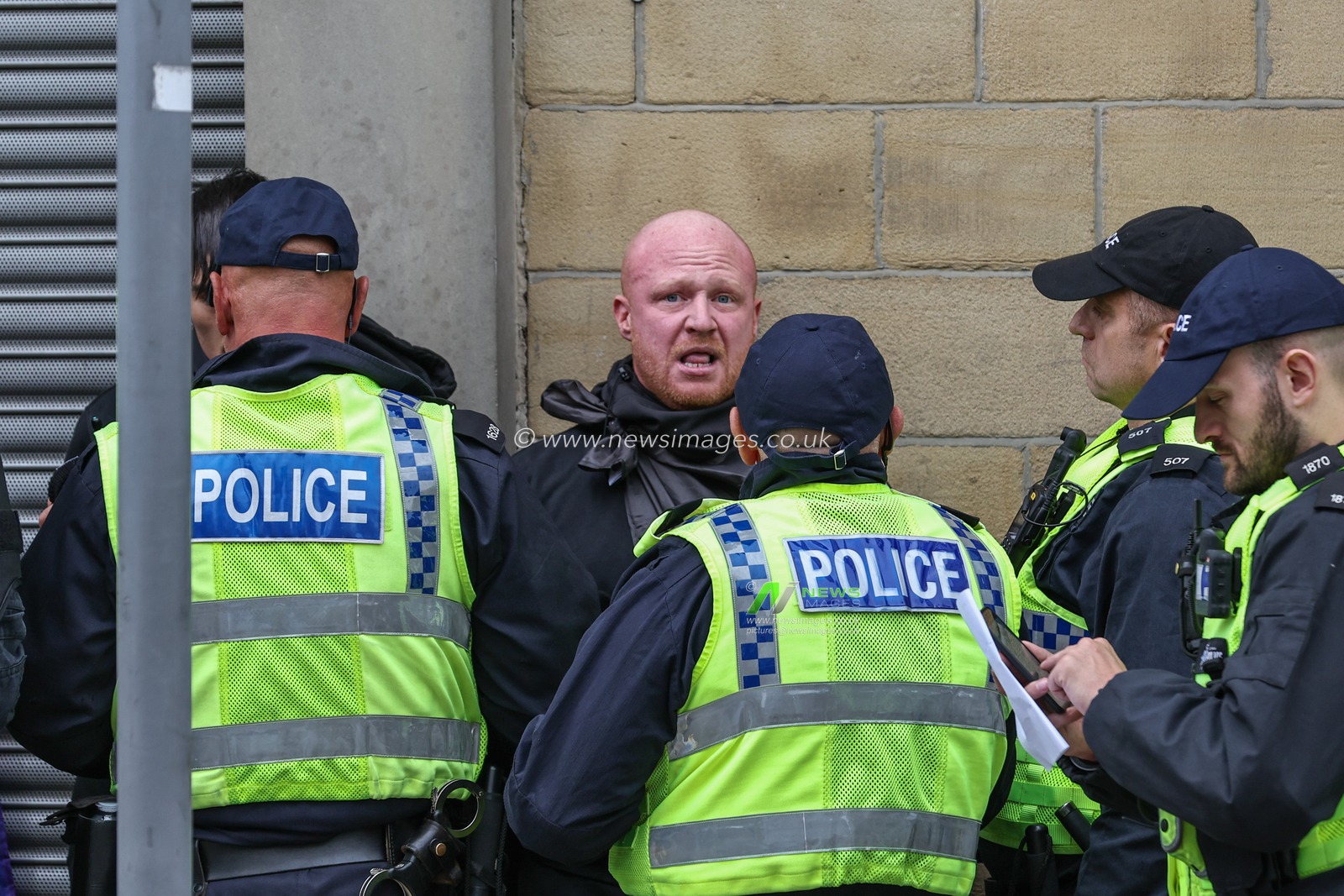 Protestors are detained by the police during an anti-racism protest, Barnsley, United Kingdom, 8th August 2024