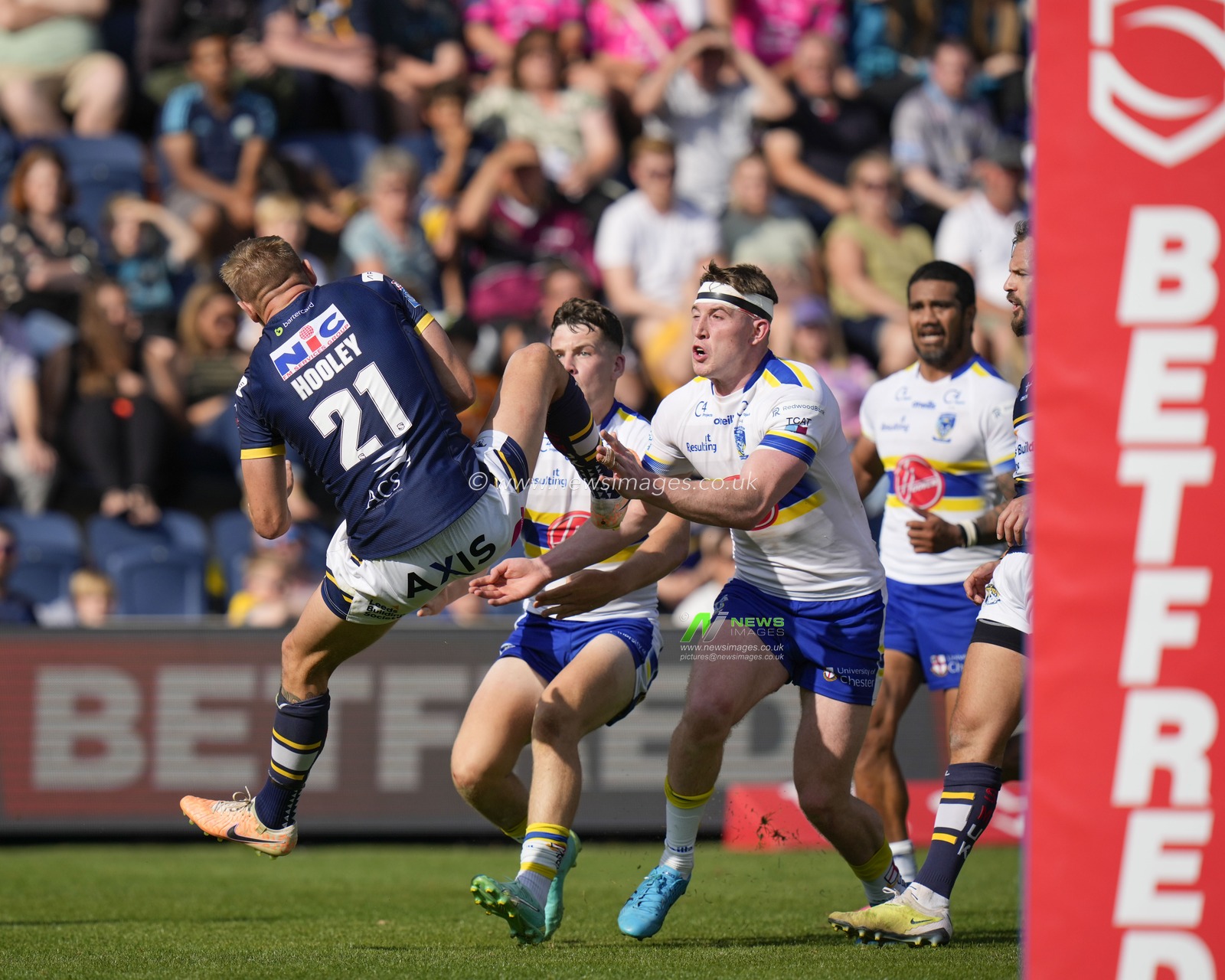 Luke Hooley #21 of Leeds Rhinos collects a high kick under pressure from Matty Nicholson #12 of Warrington Wolves and Josh Thewlis #2 of Warrington Wolves during the Betfred Super League Round 22 match Leeds Rhinos vs Warrington Wolves at Headingley Stadium, Leeds, United Kingdom, 20th August 2023

(Photo by Steve Flynn/News Images)