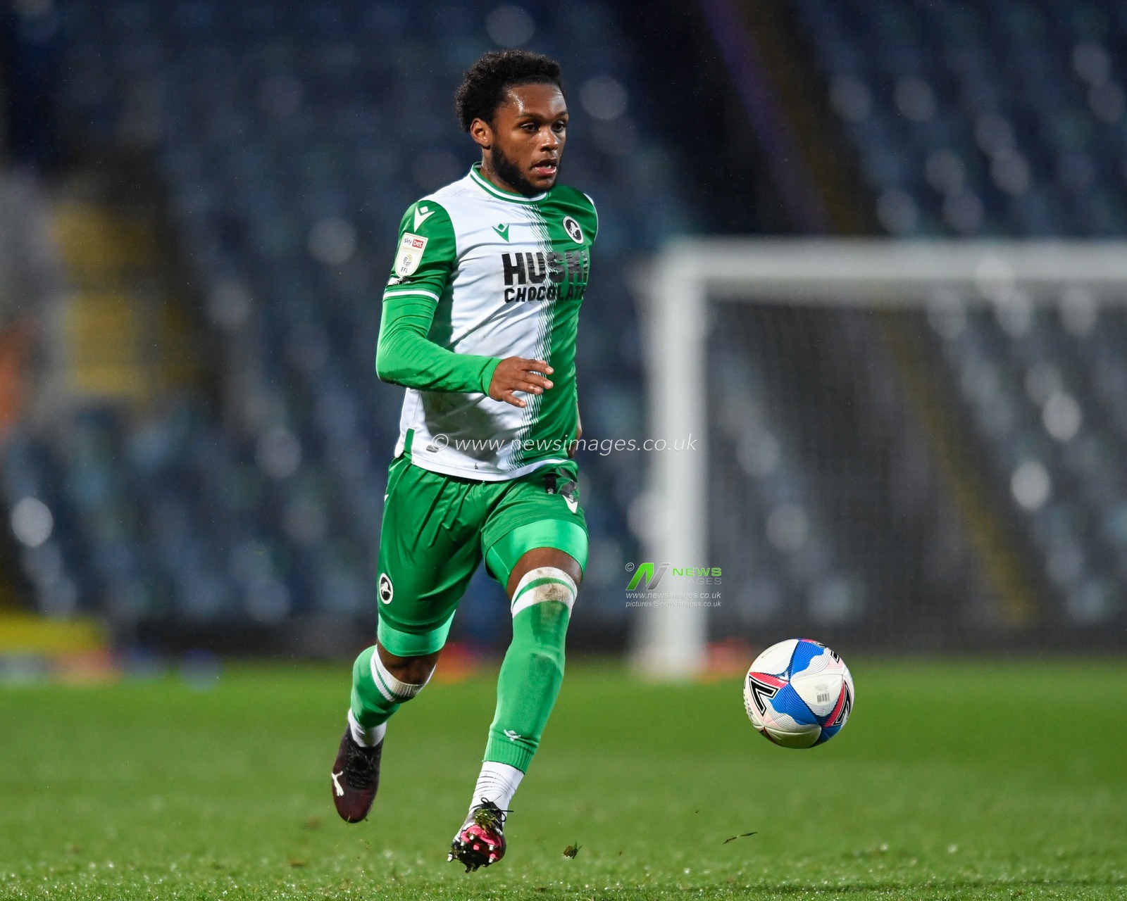 Mahlon Romeo #12 of Millwall runs forward with the ball