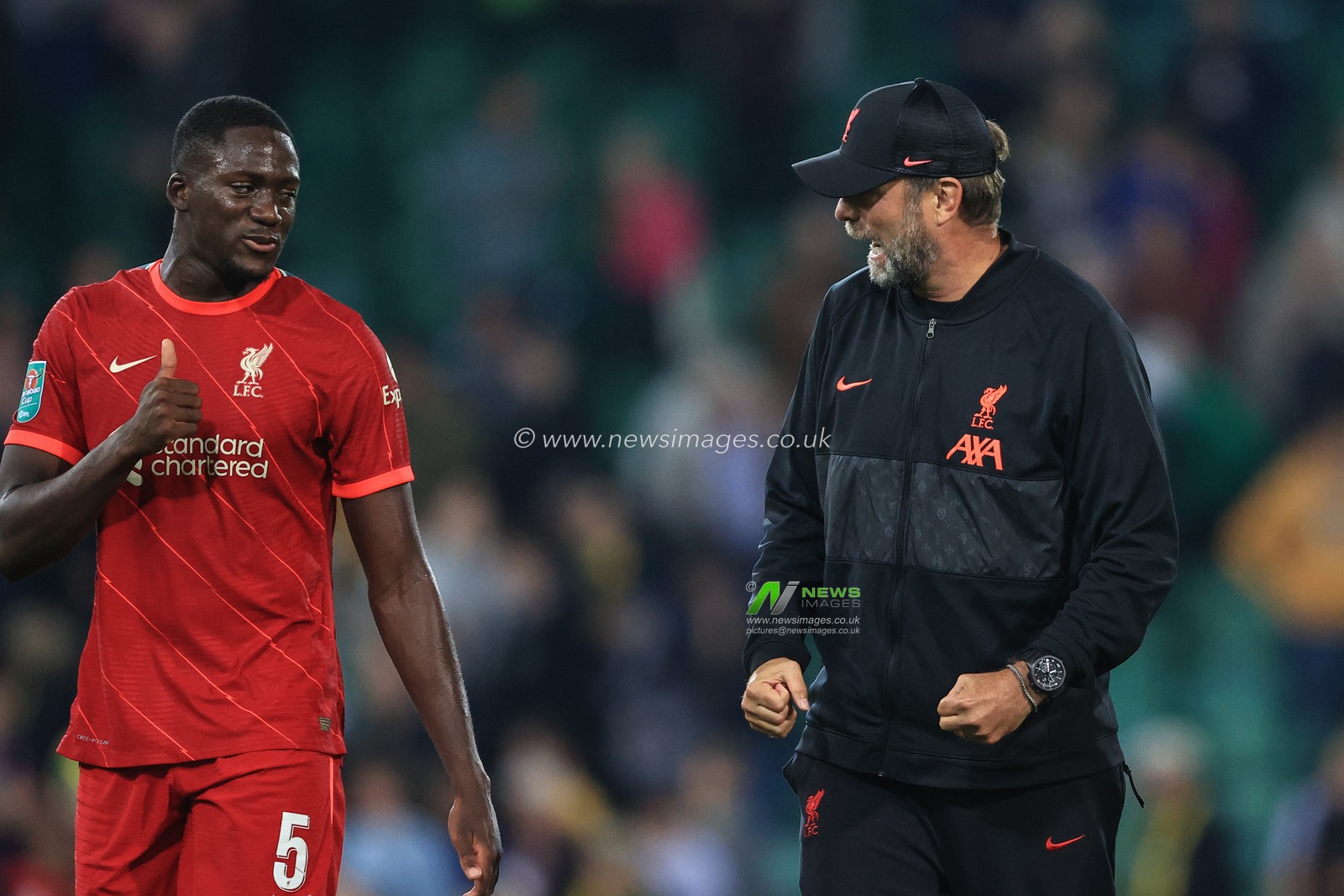 JÃ¼rgen Klopp manager of Liverpool grips his firsts and Ibrahima Konate #5 of Liverpool gives him the thumbs up after Liverpool win 0-3
