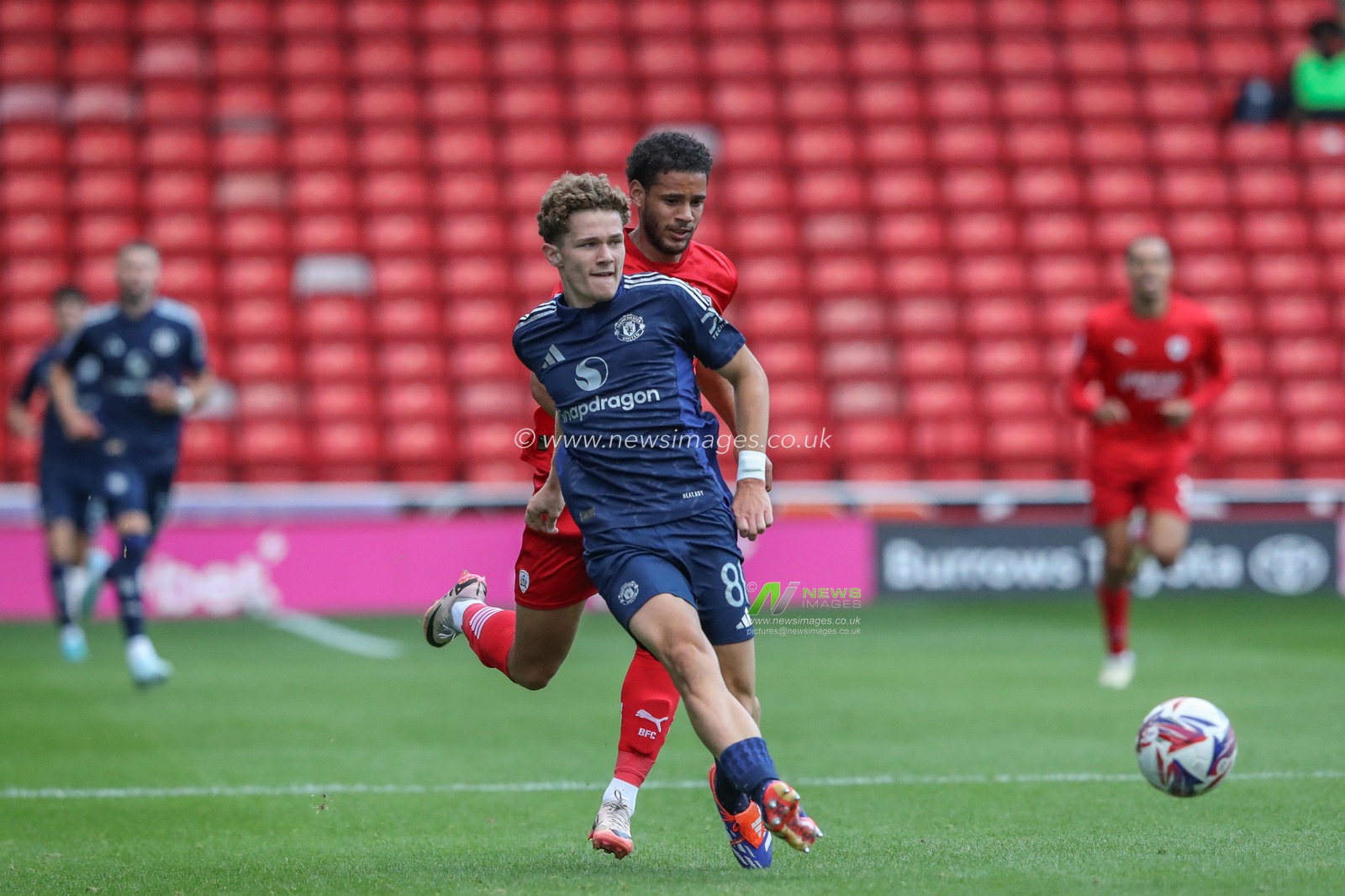 Jacob Devaney of Manchester United passes the ball during the Bristol Street Motors Trophy match Barnsley vs Manchester United U21 at Oakwell, Barnsley, United Kingdom, 20th August 2024

(Photo by Alfie Cosgrove/News Images)