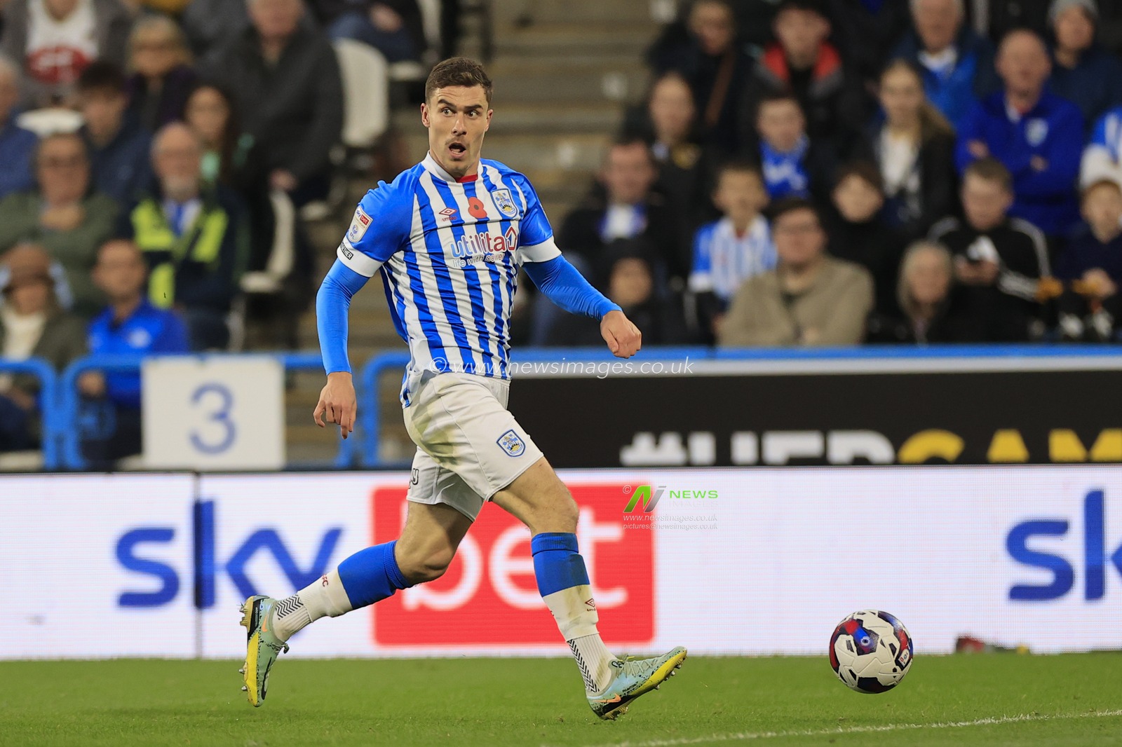 Josh Ruffels #14 of Huddersfield Town runs for the ball during the Sky Bet Championship match Huddersfield Town vs Swansea City at John Smith's Stadium, Huddersfield, United Kingdom, 12th November 2022

(Photo by Conor Molloy/News Images)