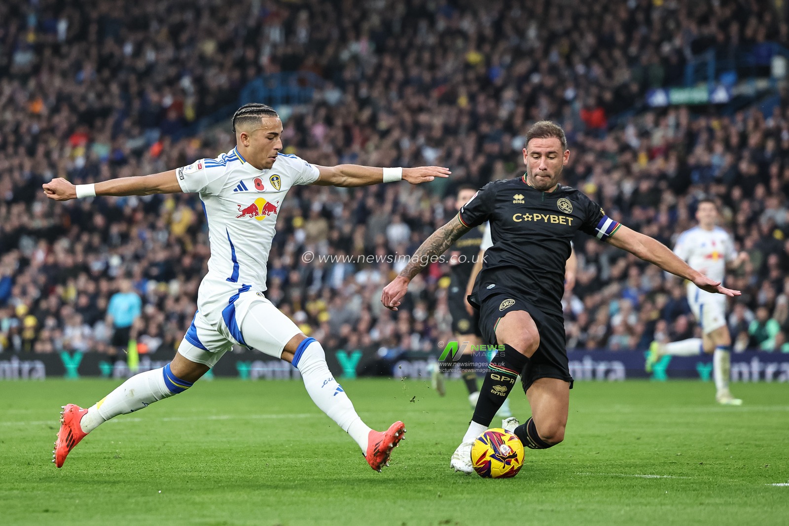 Steve Cook of Queens Park Rangers tackles Mateo Joseph of Leeds United during the Sky Bet Championship match Leeds United vs Queens Park Rangers at Elland Road, Leeds, United Kingdom, 9th November 2024

(Photo by Mark Cosgrove/News Images)