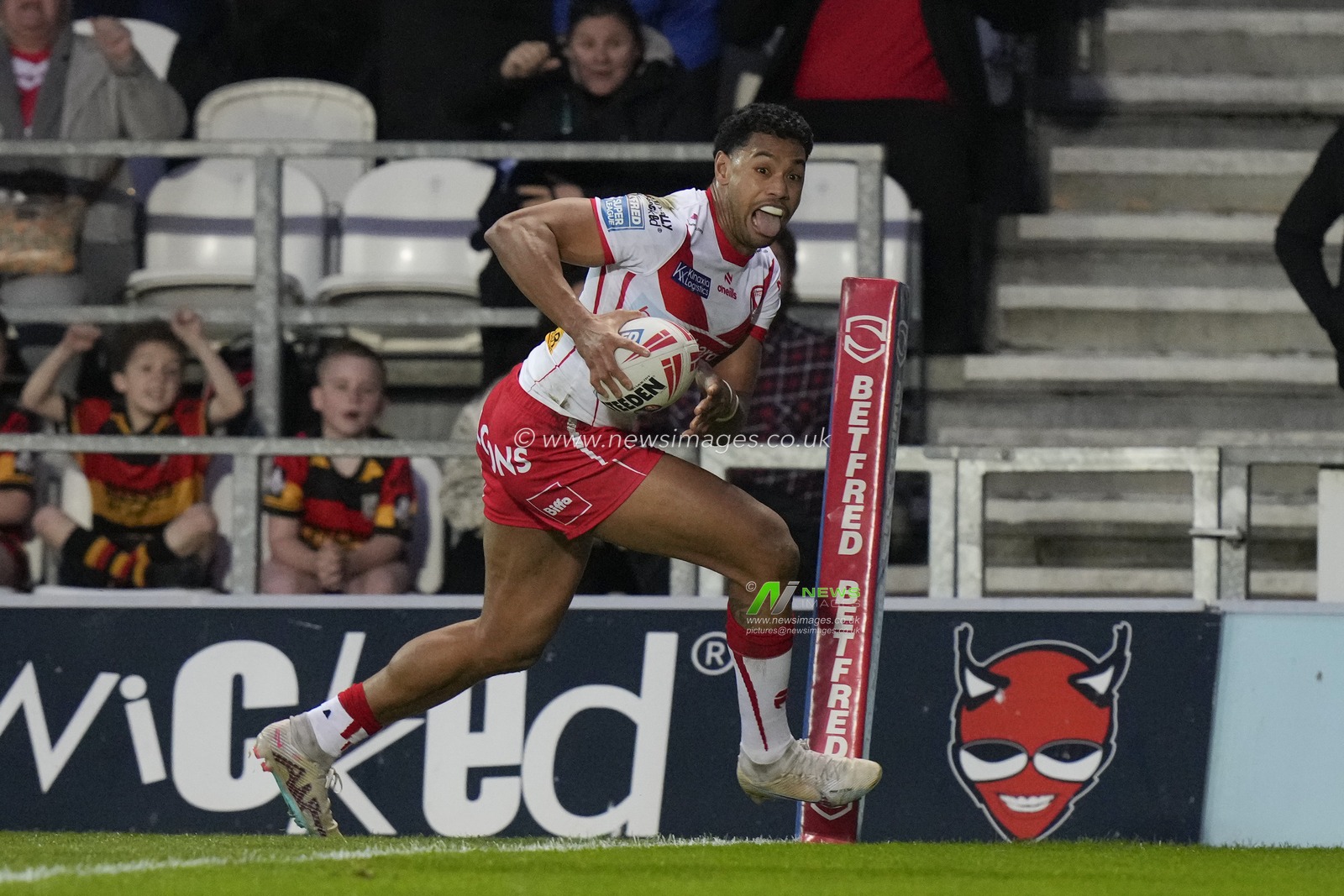 Waqa Blake of St. Helens runs in to score a try during the Betfred Super League  Round 8 match St Helens vs Hull FC at Totally Wicked Stadium, St Helens, United Kingdom, 19th April 2024

(Photo by Steve Flynn/News Images)