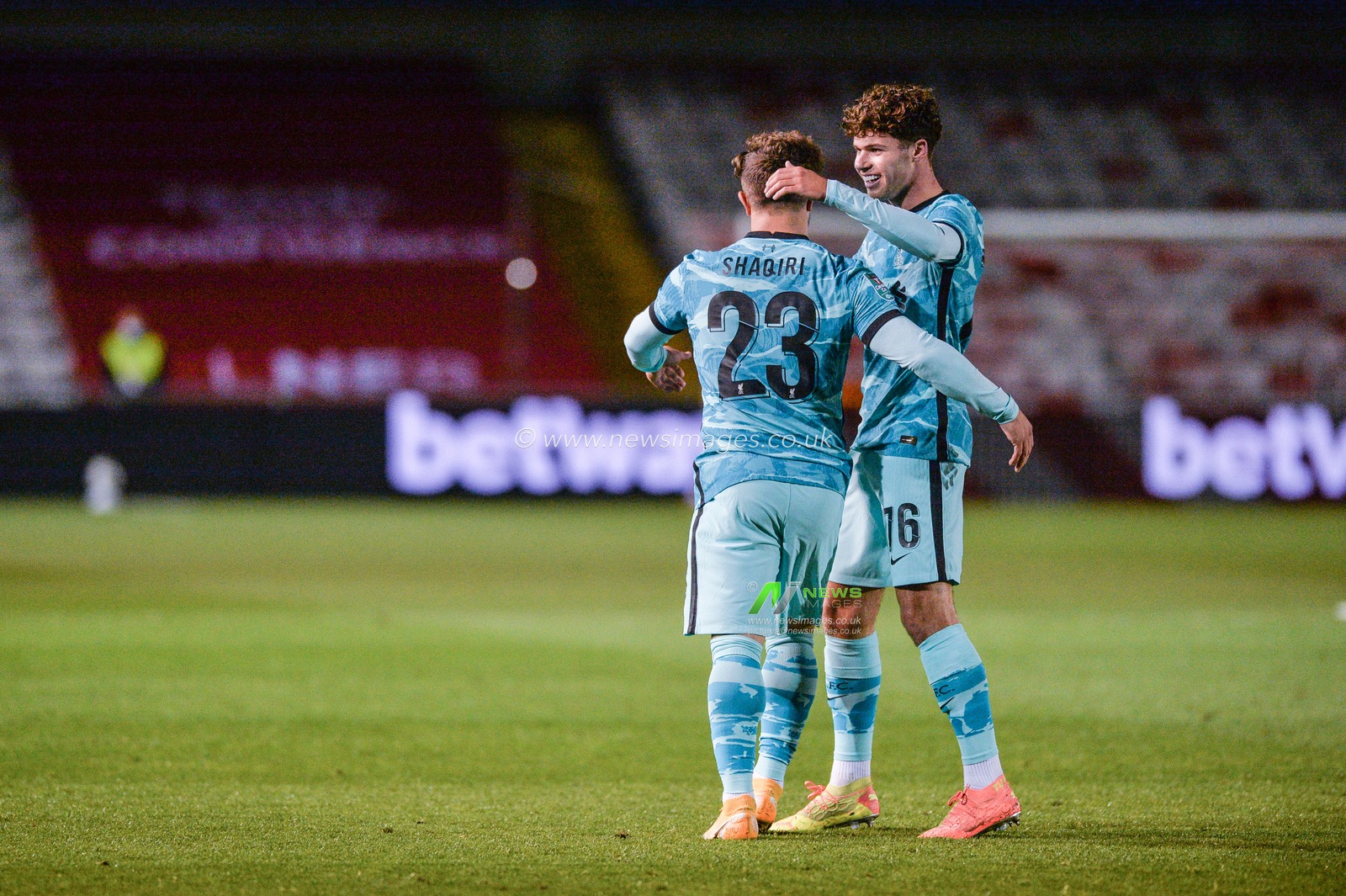Neco Williams (76) congratulates Xherdan Shaqiri (23) of Liverpool
