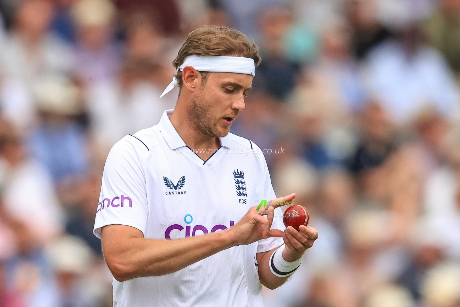 Stuart Broad of England inspects the ball