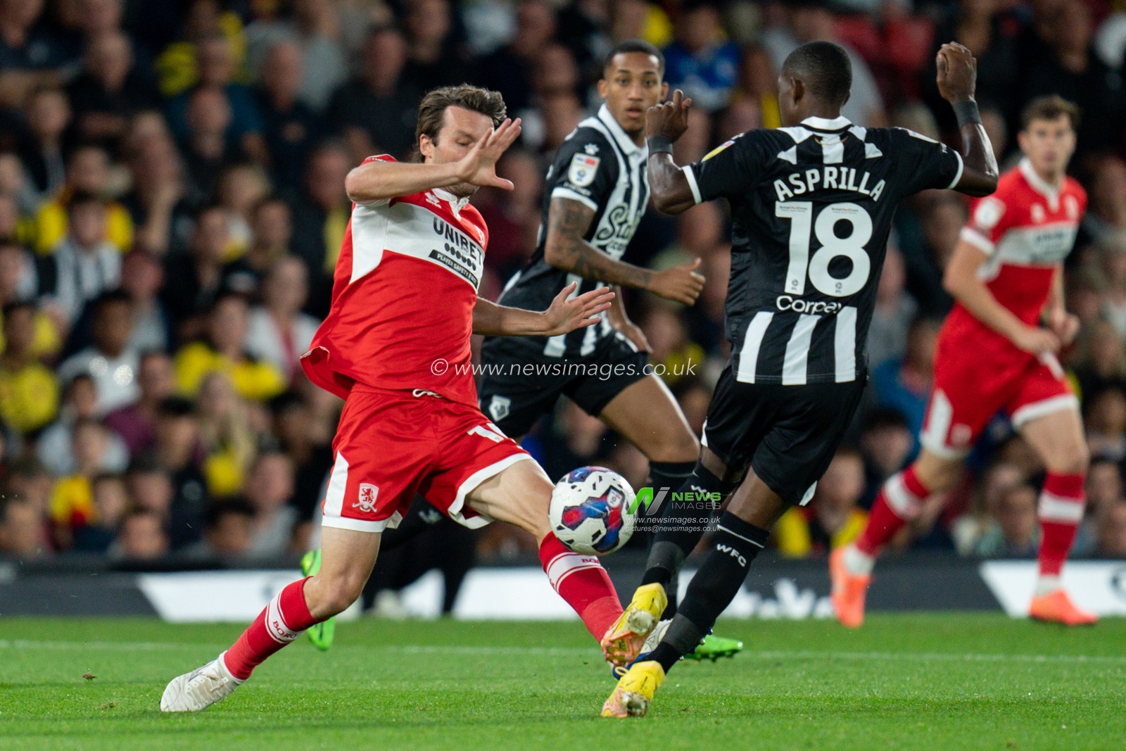 Jonathan Howson #16 of Middlesbrough battle for the ball Yaser Asprilla #18 of Watford