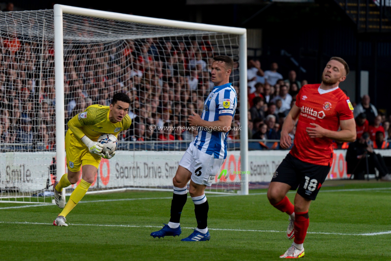 Lee Nicholls #21 of Huddersfield Town looks to set up another attack