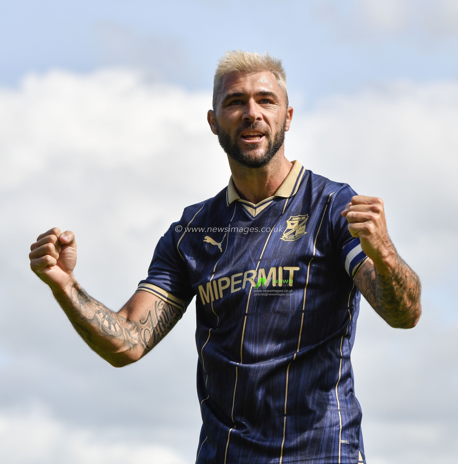 Swindon's Charlie Austin celebrates the opening goal of the match, during the Sky Bet League 2 match Wrexham vs Swindon Town at The Racecourse Ground, Wrexham, United Kingdom, 19th August 2023

(Photo by Cody Froggatt/News Images)