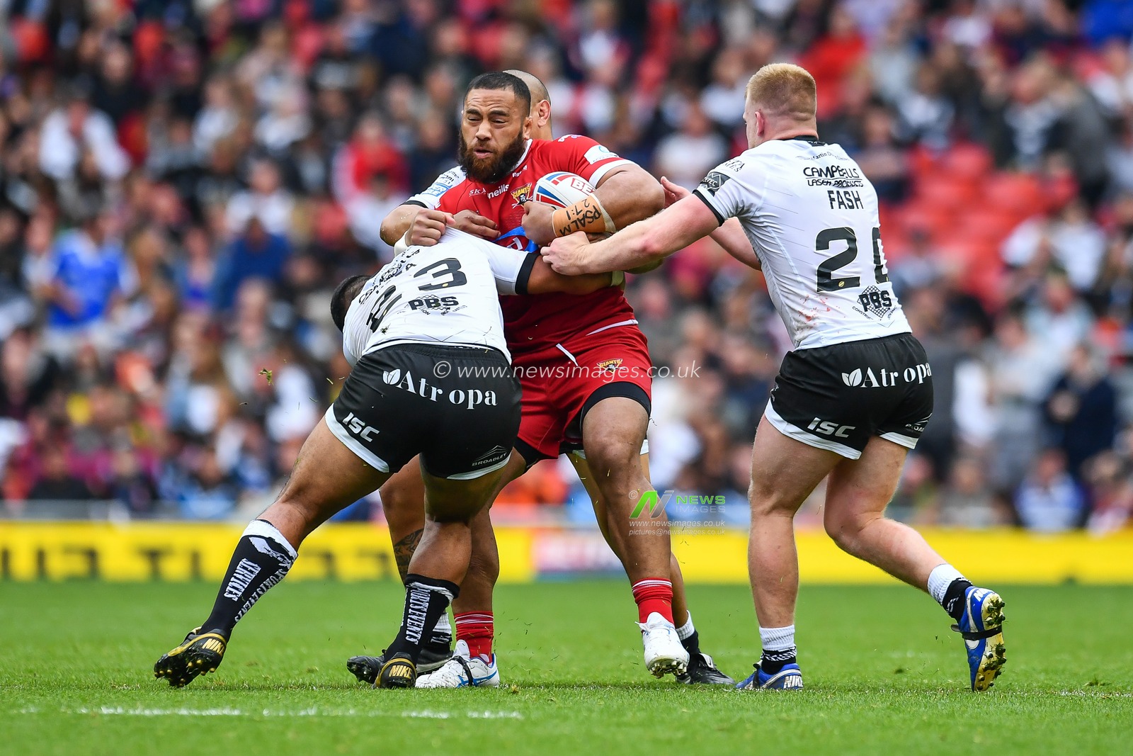 25th May 2019 , Anfield Stadium, Liverpool, England; Dacia Magic Weekend, Betfred Super League Round 16, Hull FC vs Huddersfield Giants ; Suaia Matagi (10) of Huddersfield Giants is tackled by Mickey Paea (23) of Hull FC 

Credit: Craig Thomas/News Images