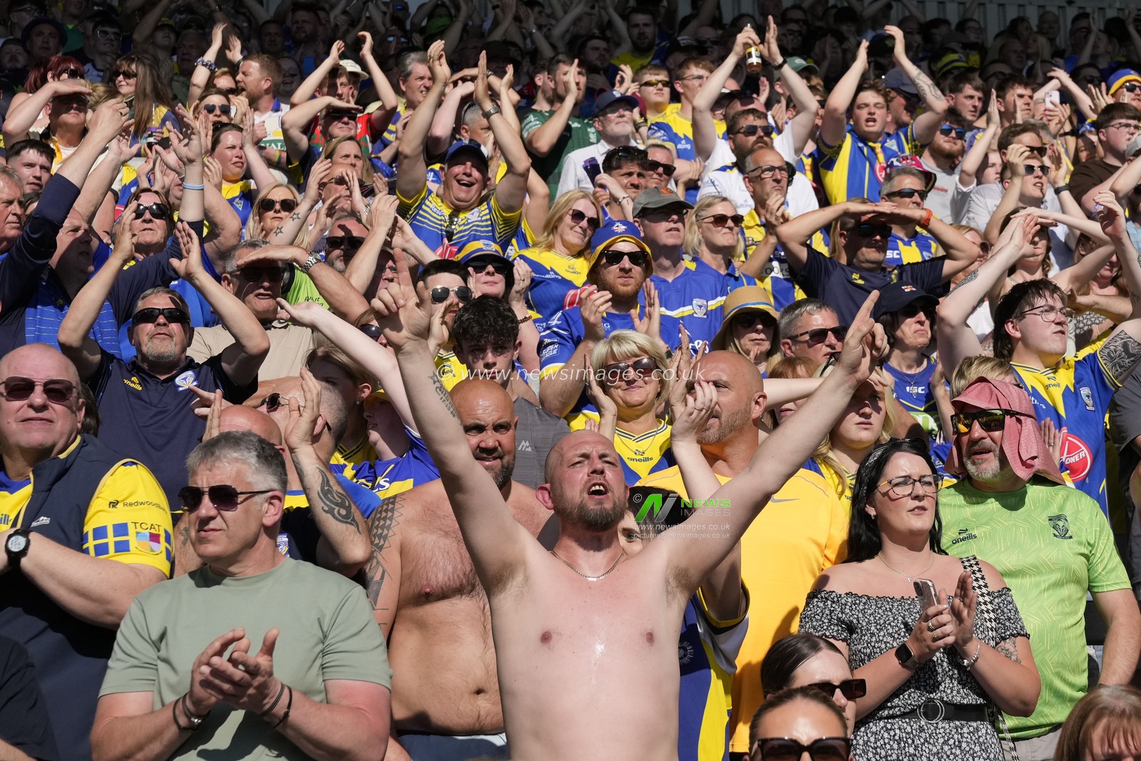 Warrington Wolves fans cheer on their side during the Betfred Challenge Cup Semi-Final match Huddersfield Giants vs Warrington Wolves at Totally Wicked Stadium, St Helens, United Kingdom, 19th May 2024

(Photo by Steve Flynn/News Images)