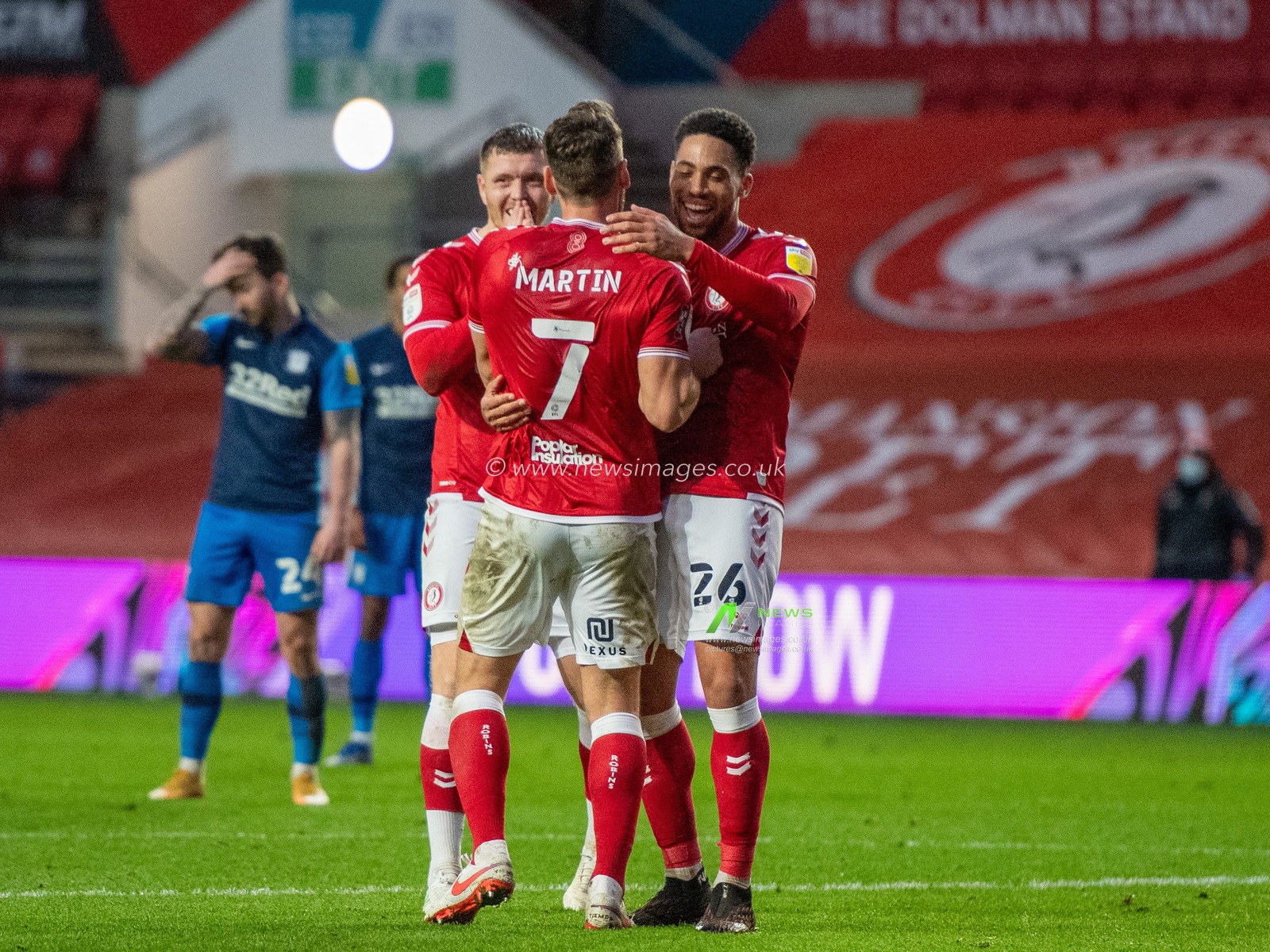 Zak Vyner #26 of Bristol City celebrates his goal with team mates Chris Martin #7 of Bristol City and Alfie Mawson #5 of Bristol City with Sean Maguire #24 of Preston North End in disbelief