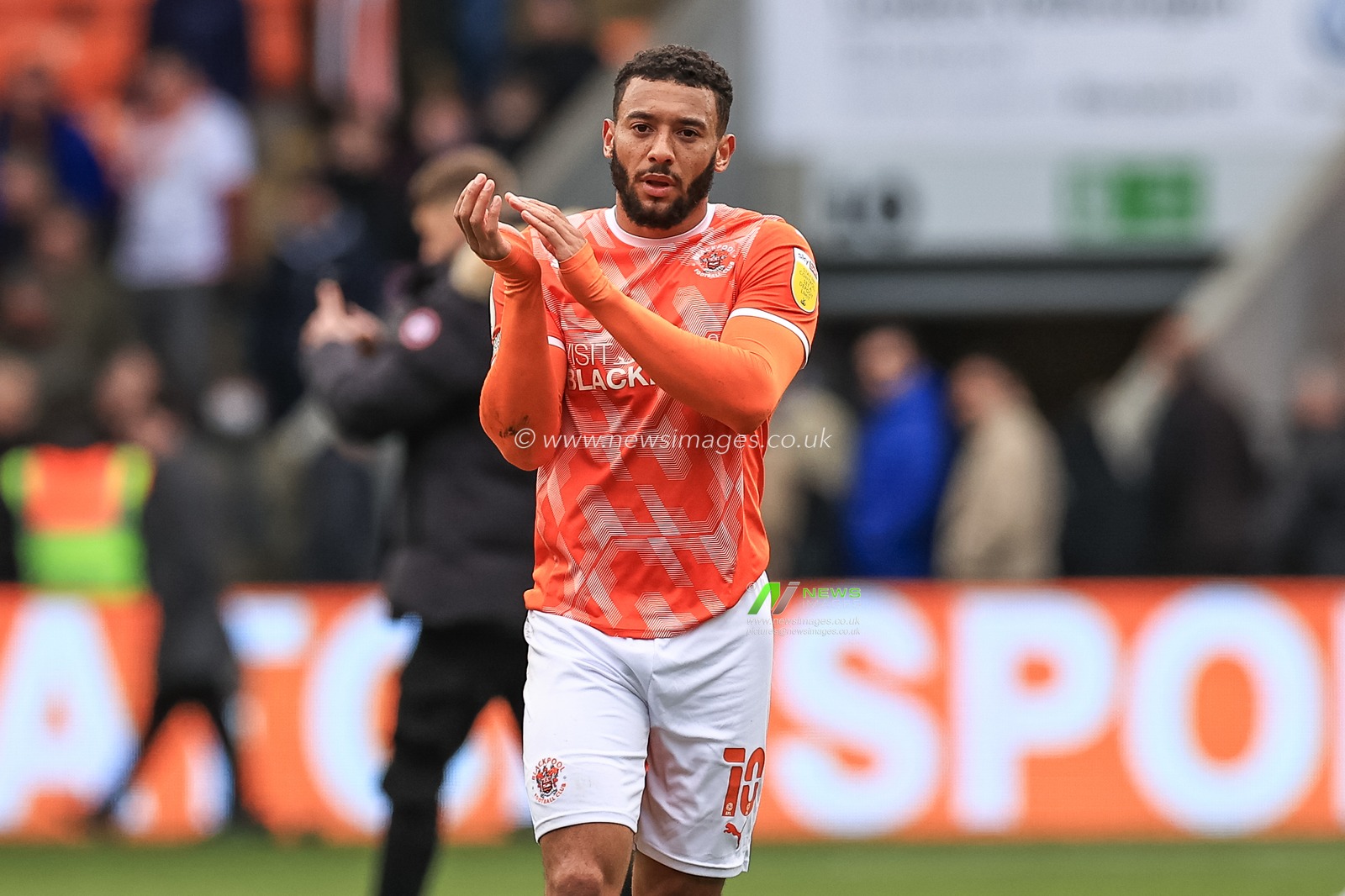 Keshi Anderson #10 of Blackpool applauds the fans