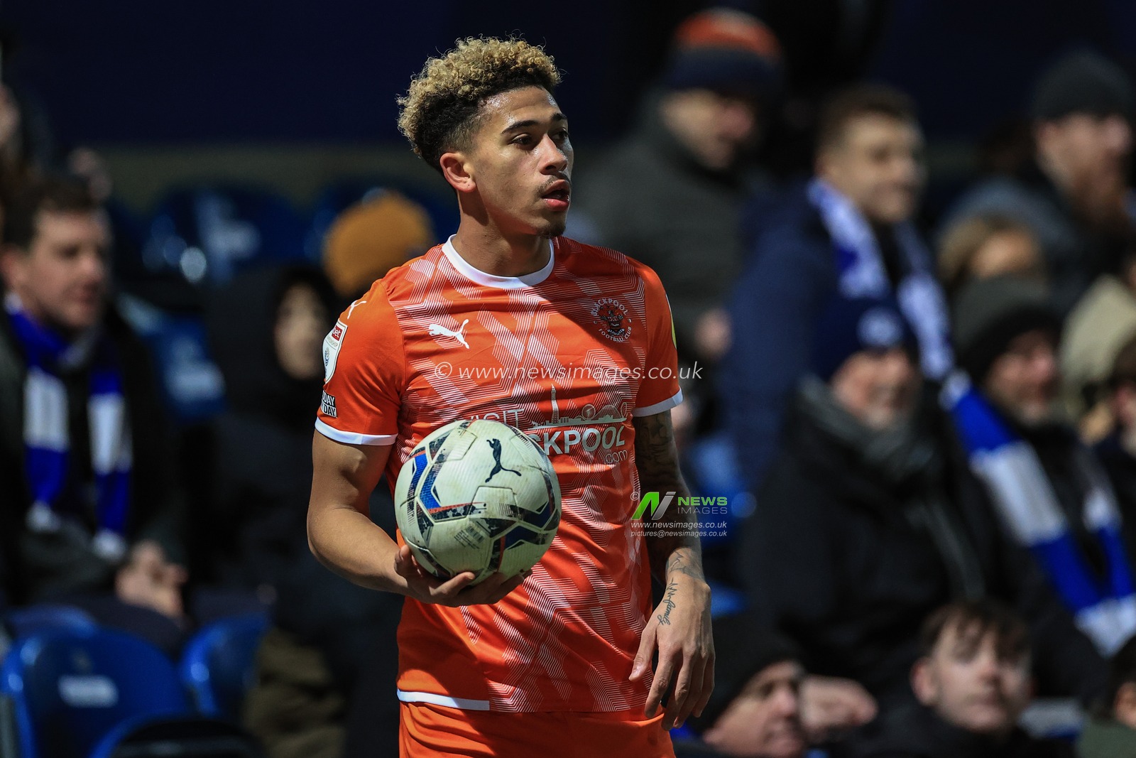 Jordan Lawrence-Gabriel #4 of Blackpool takes a throw-in