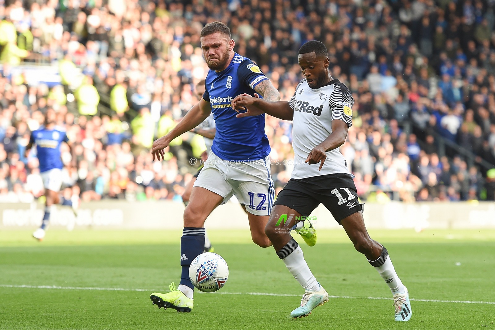 28th September 2019, Pride Park Stadium, Derby, England; Sky Bet Championship, Derby County v Birmingham City : Harlee Dean (12) of Birmingham City closes on Florian Jozefzoon (11) of Derby County 

Credit: Jon Hobley/News Images