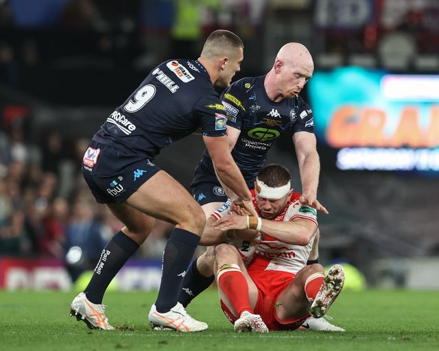 James Batchelor of Hull KR is tackled by Brad O'neill of Wigan Warriors during the 2025 Betfred Super League Grand Final Hull KR v Wigan Warriors at Old Trafford, Manchester, United Kingdom, 11th October 2025

(Photo by Alfie Cosgrove/News Images)